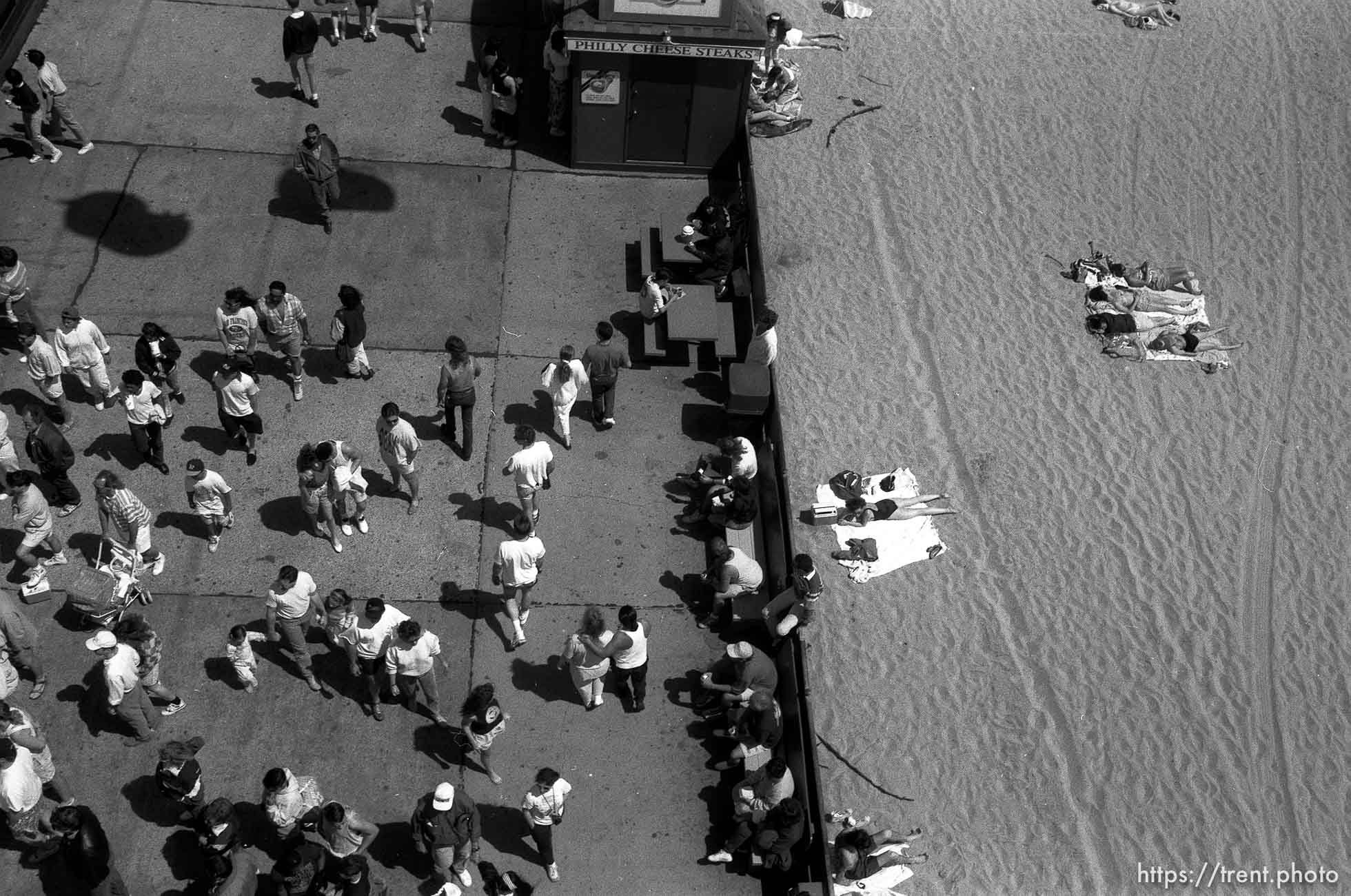 People on beach and boardwalk.