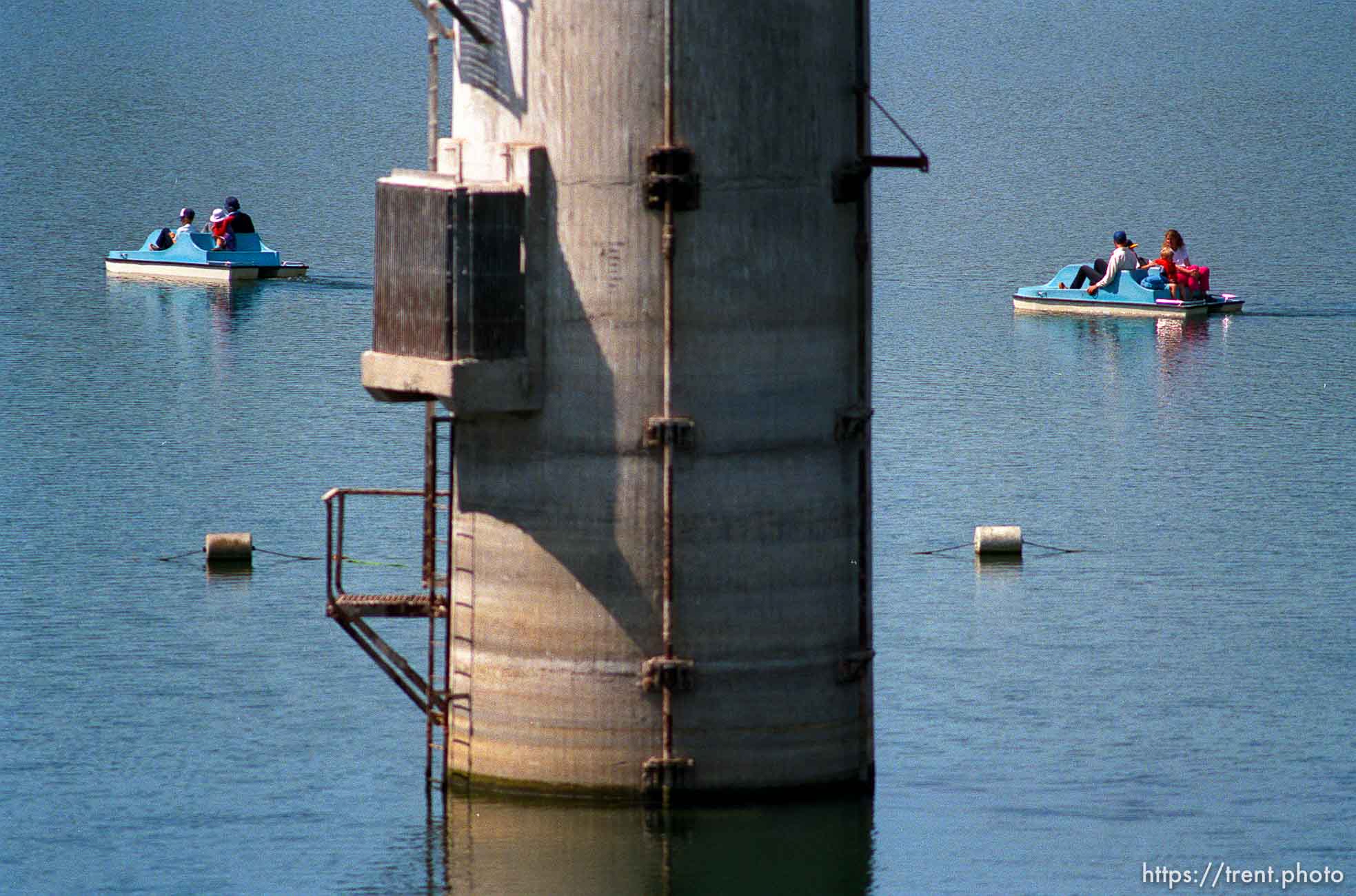 People on paddle-boats at the Lafayette Reservoir