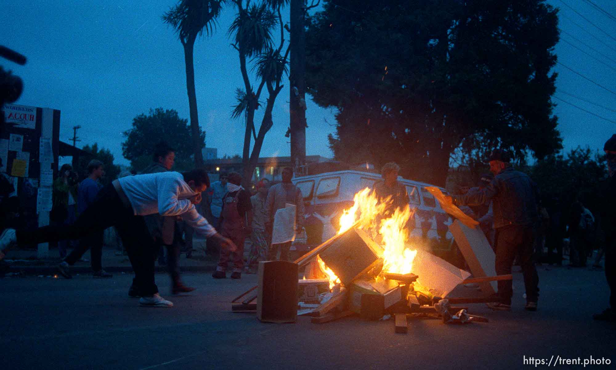 Protesters start a fire during riots and protests.