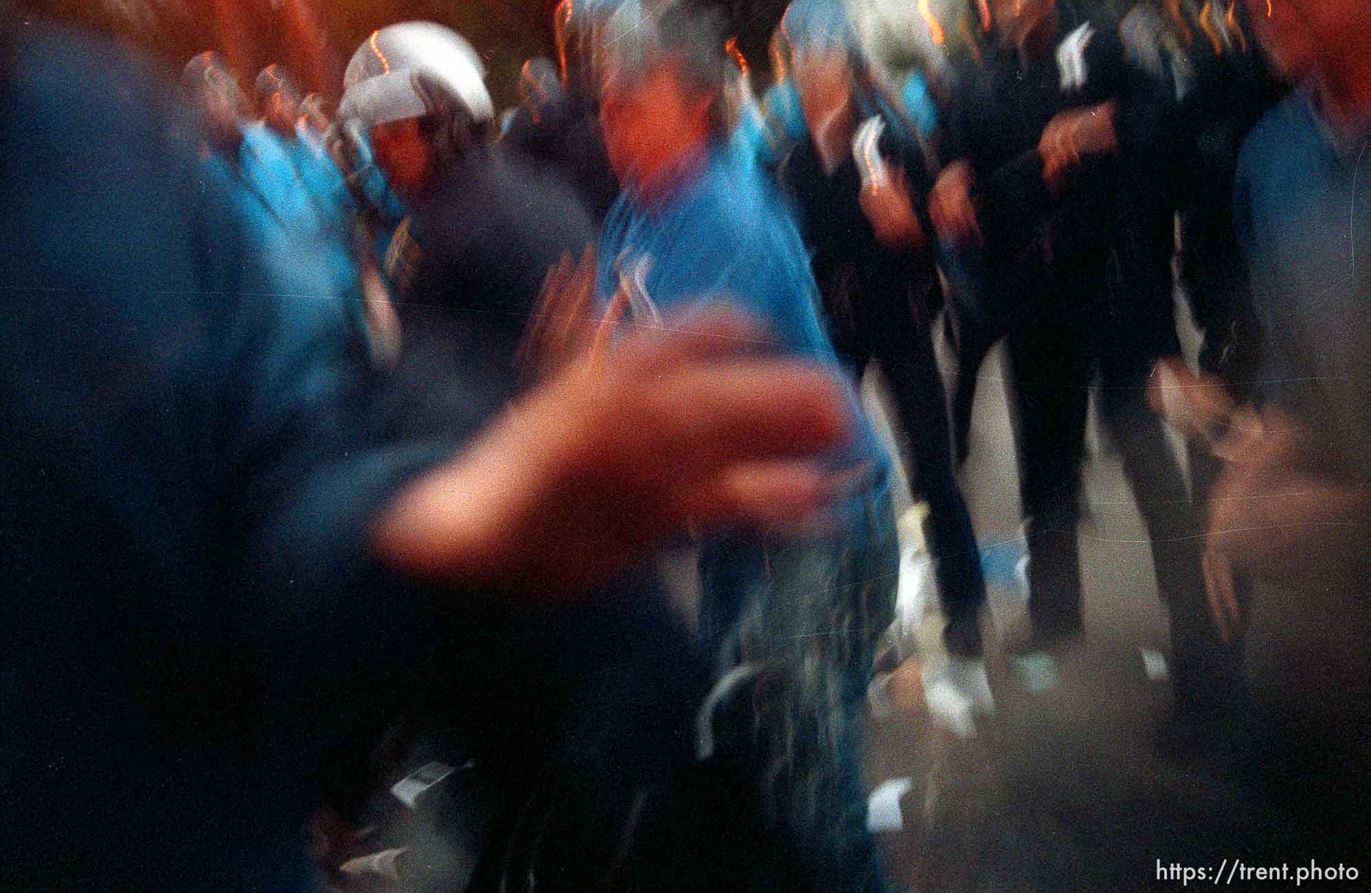 Police charge in (slow shutter) during riots and protests.