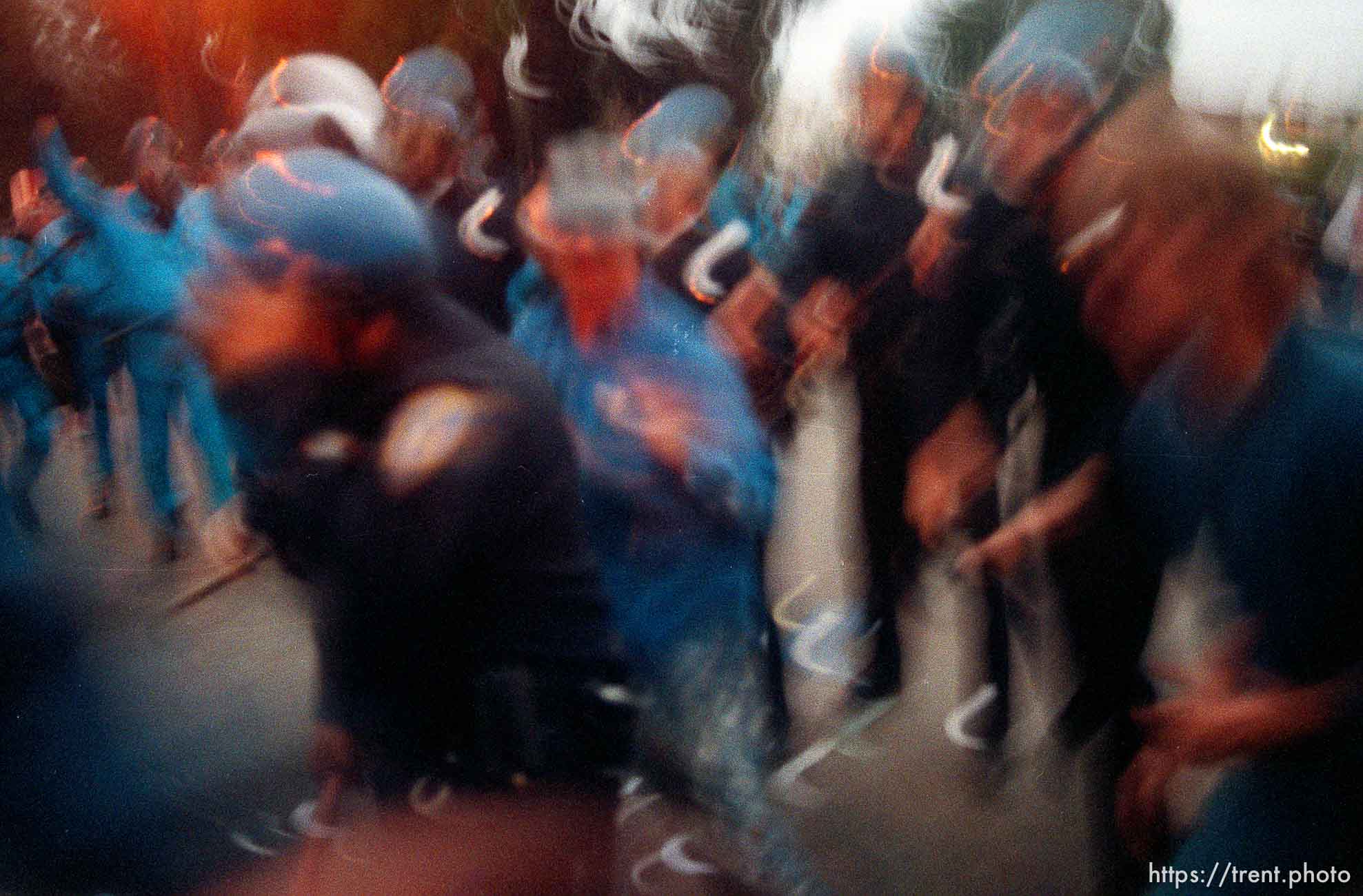 Police charge in (slow shutter) during riots and protests.