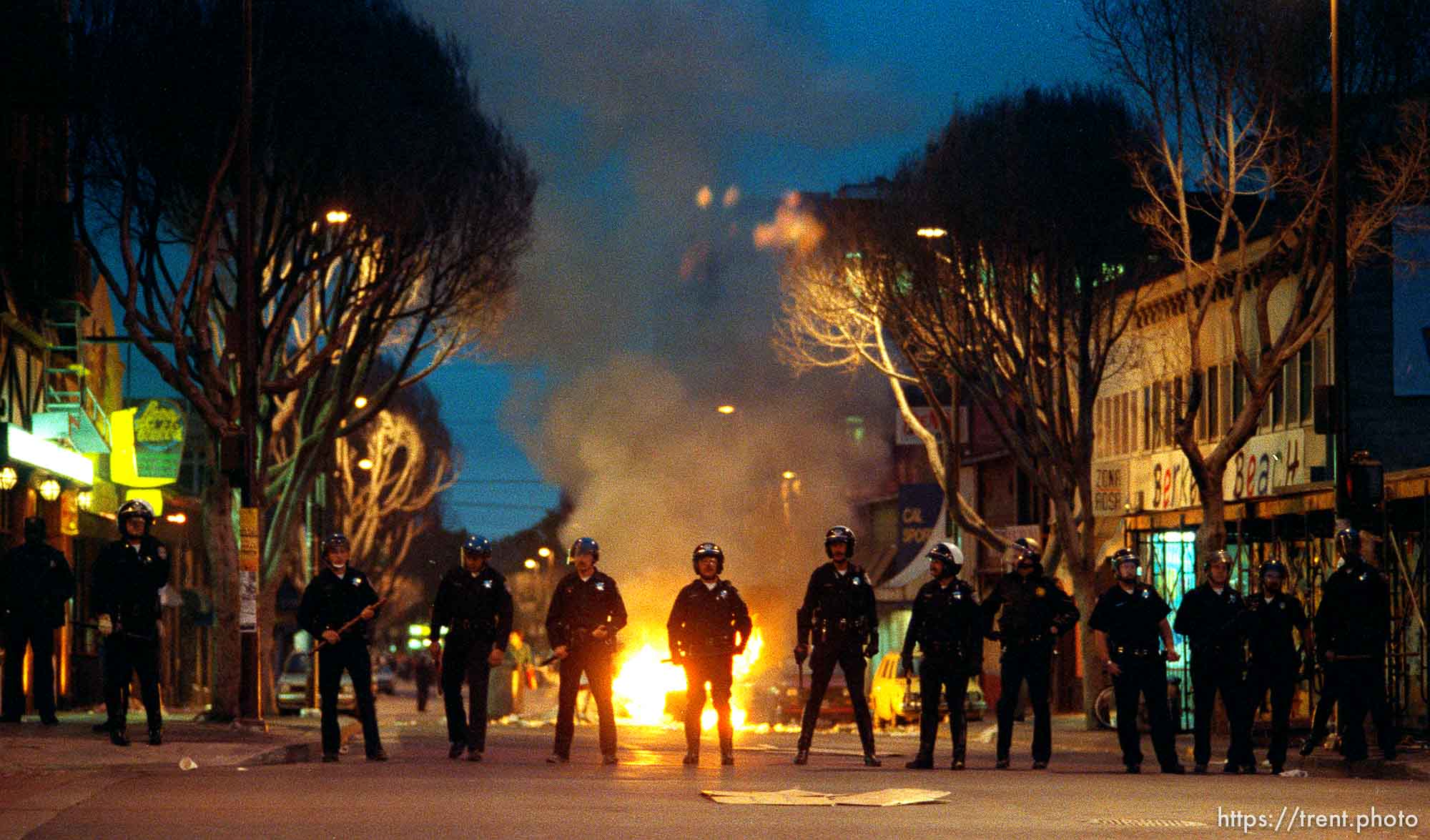 Police line and fires during riots and protests.