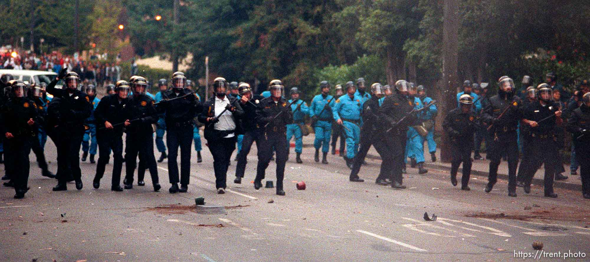 Police line is pelted with rocks during riots and protests.