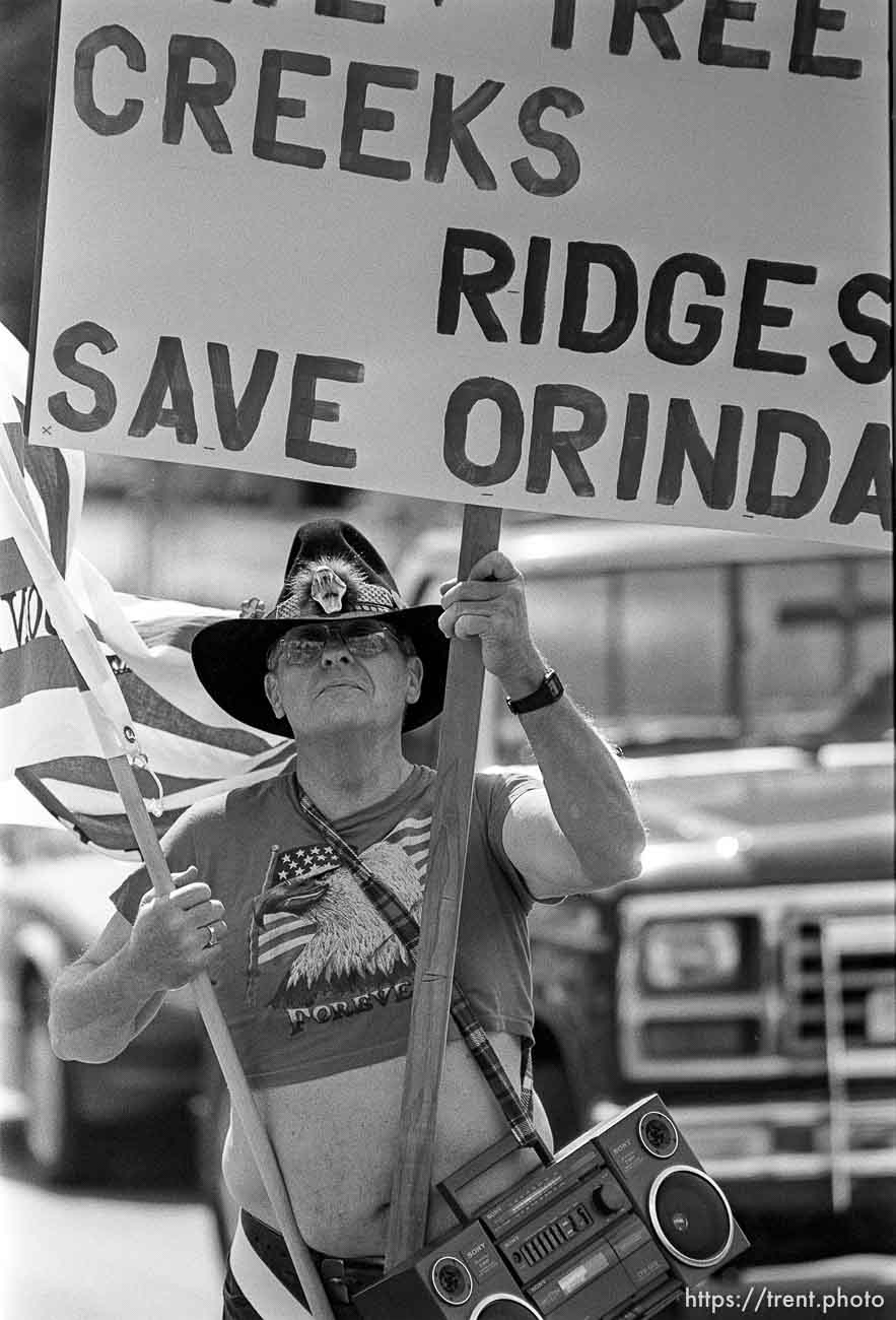 Ray Davis carrying open space sign in parade