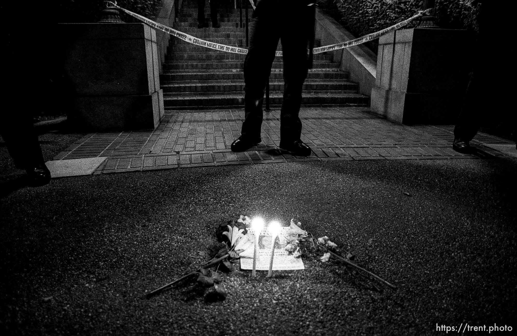 Police and candles in front of the UC Berkeley dean's house at Rosebud protest