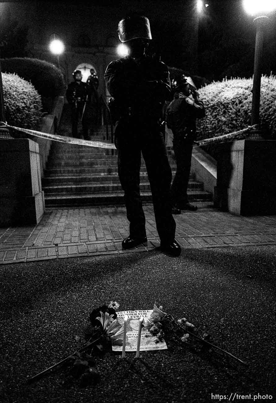 Police and candles in front of the UC Berkeley dean's house at Rosebud protest