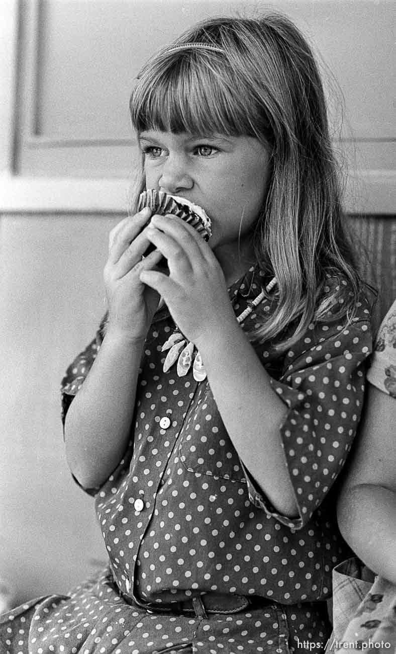 Girl eats cupcake on the first day of kindergarten (Mrs Griebstein's class).