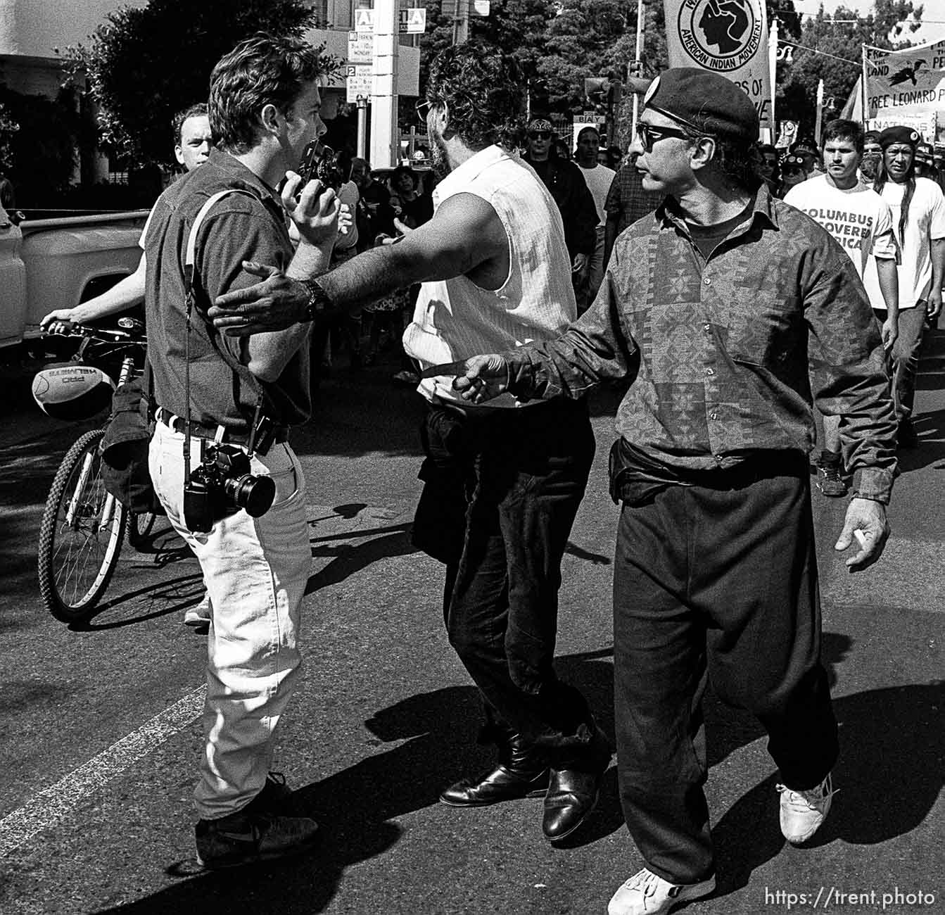 D having trouble with American Indian Movement people at anti-Christopher Columbus protest.