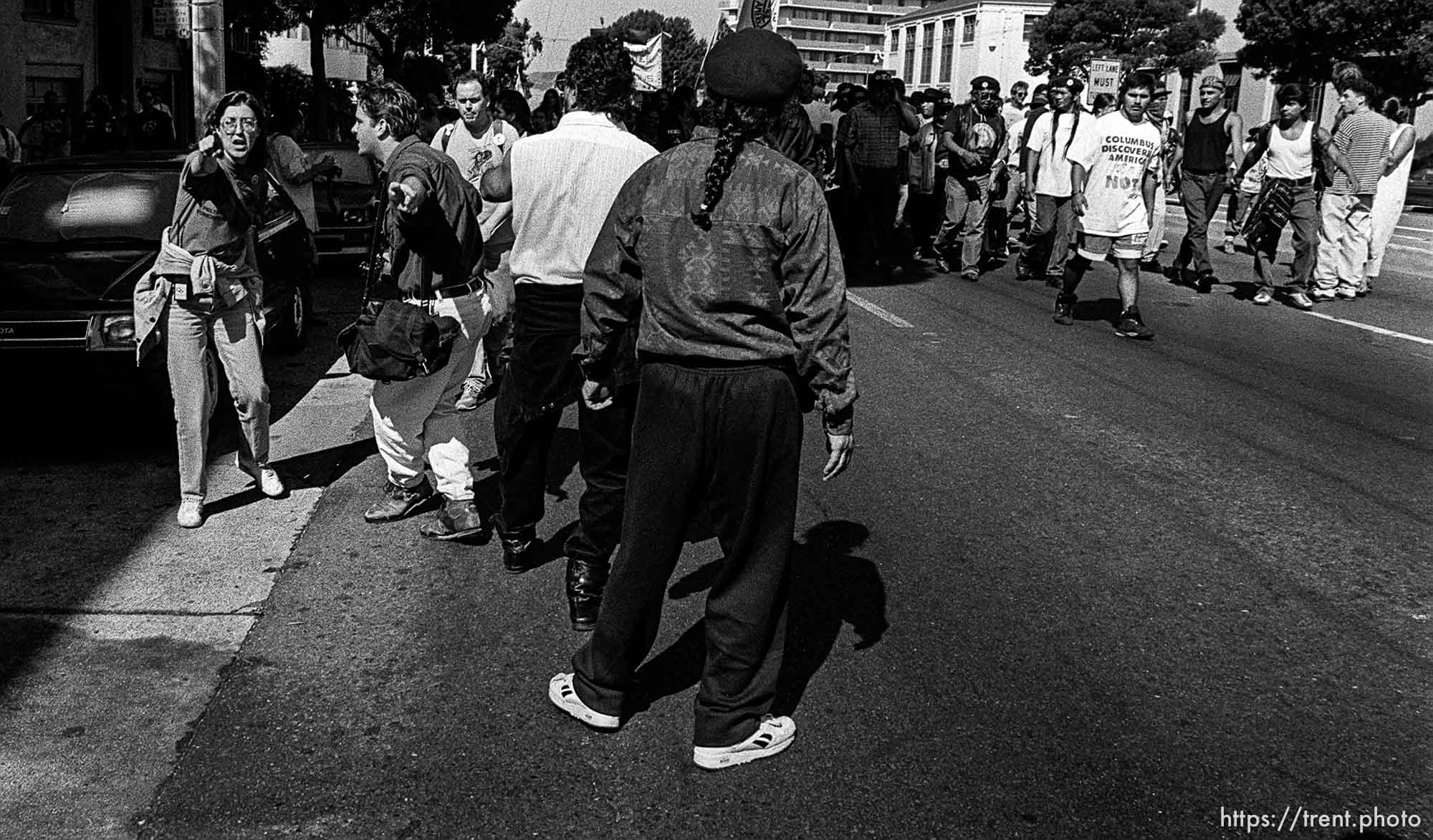 D having trouble with American Indian Movement people at anti-Christopher Columbus protest.