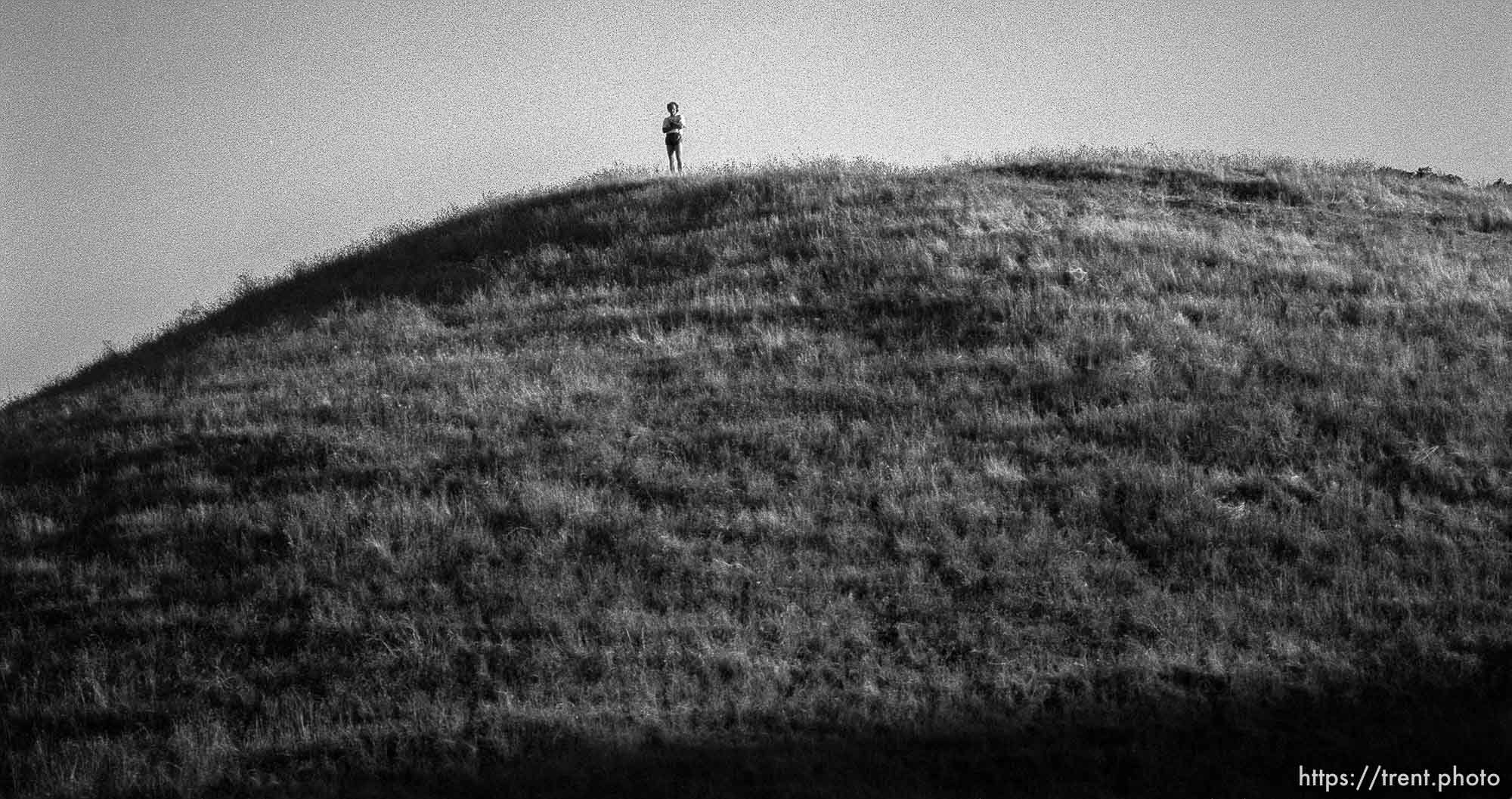 Ramsey Clark on top of a hill at Cross Country Meet.