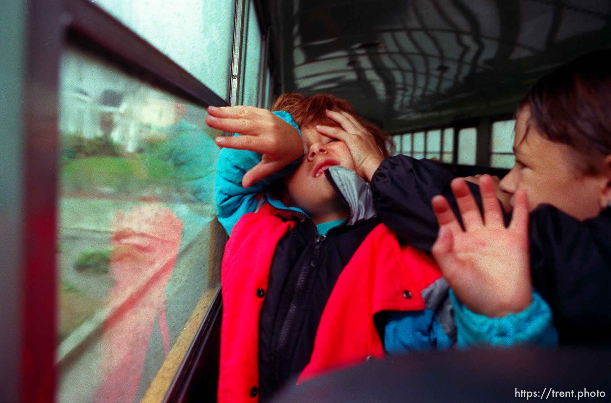 Kids fighting on school bus.