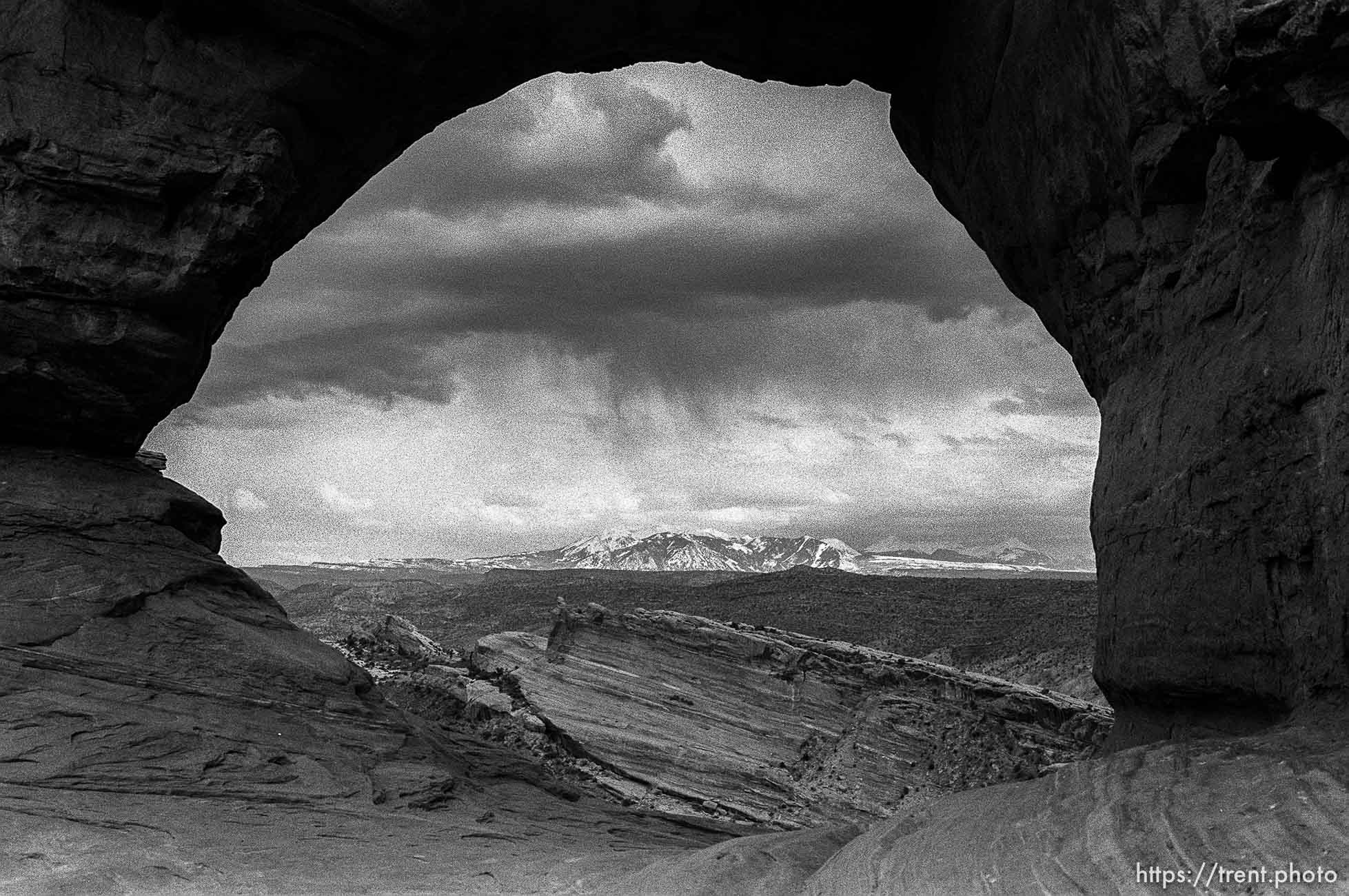 La Sal Mountains seen through a rock window at Arches National Park