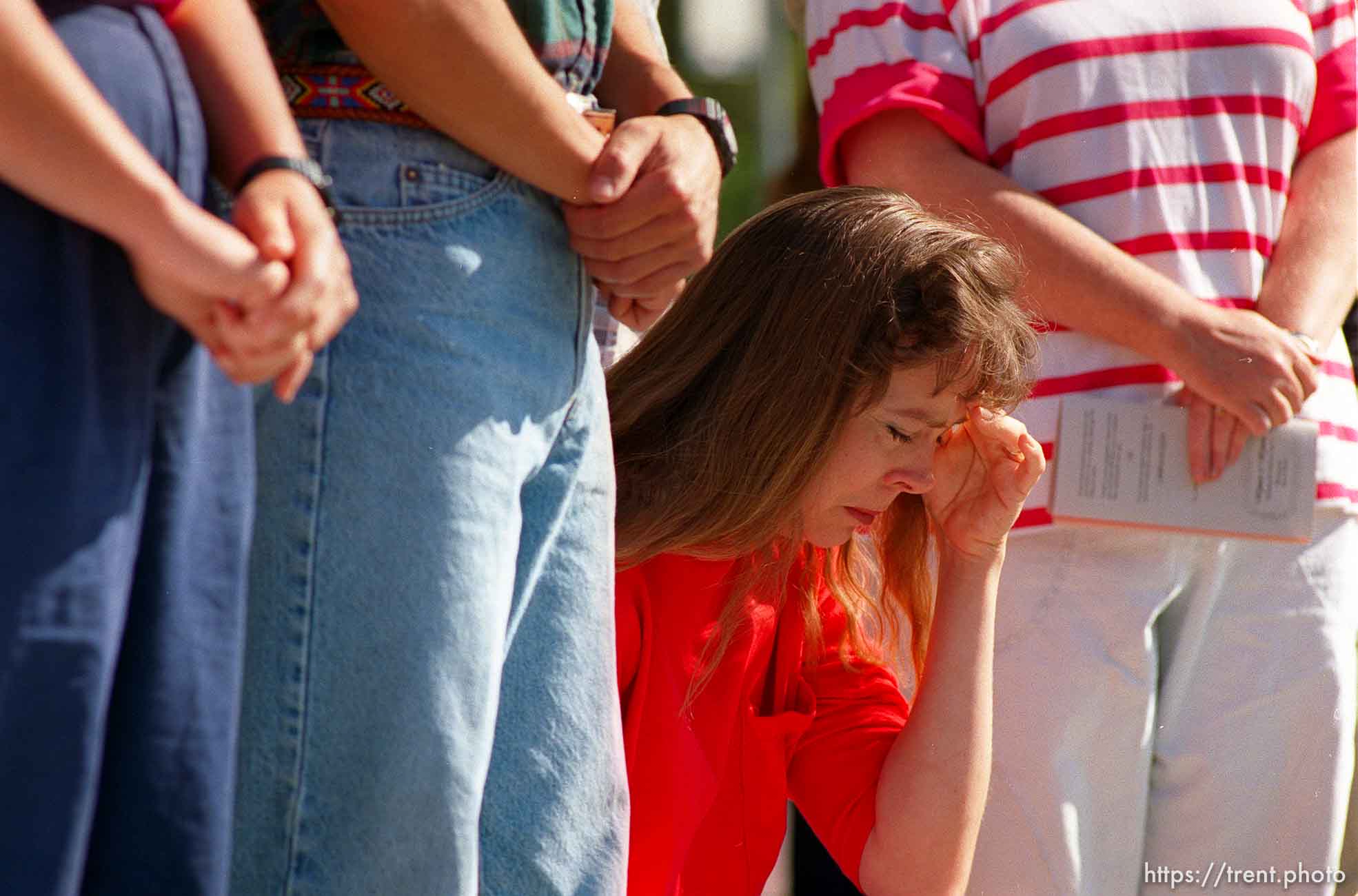 Woman prays at Operation Rescue abortion protest at Planned Parenthood clinic.