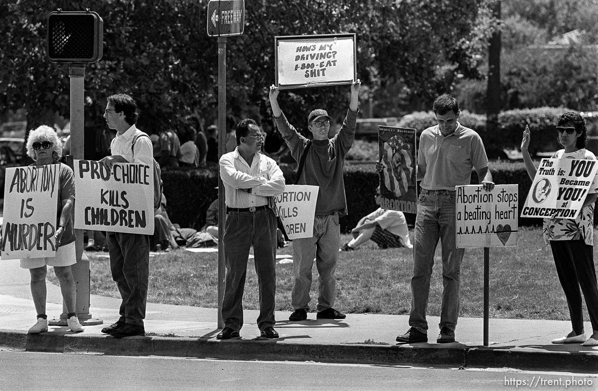 AQ as Protest Boy at abortion protest.