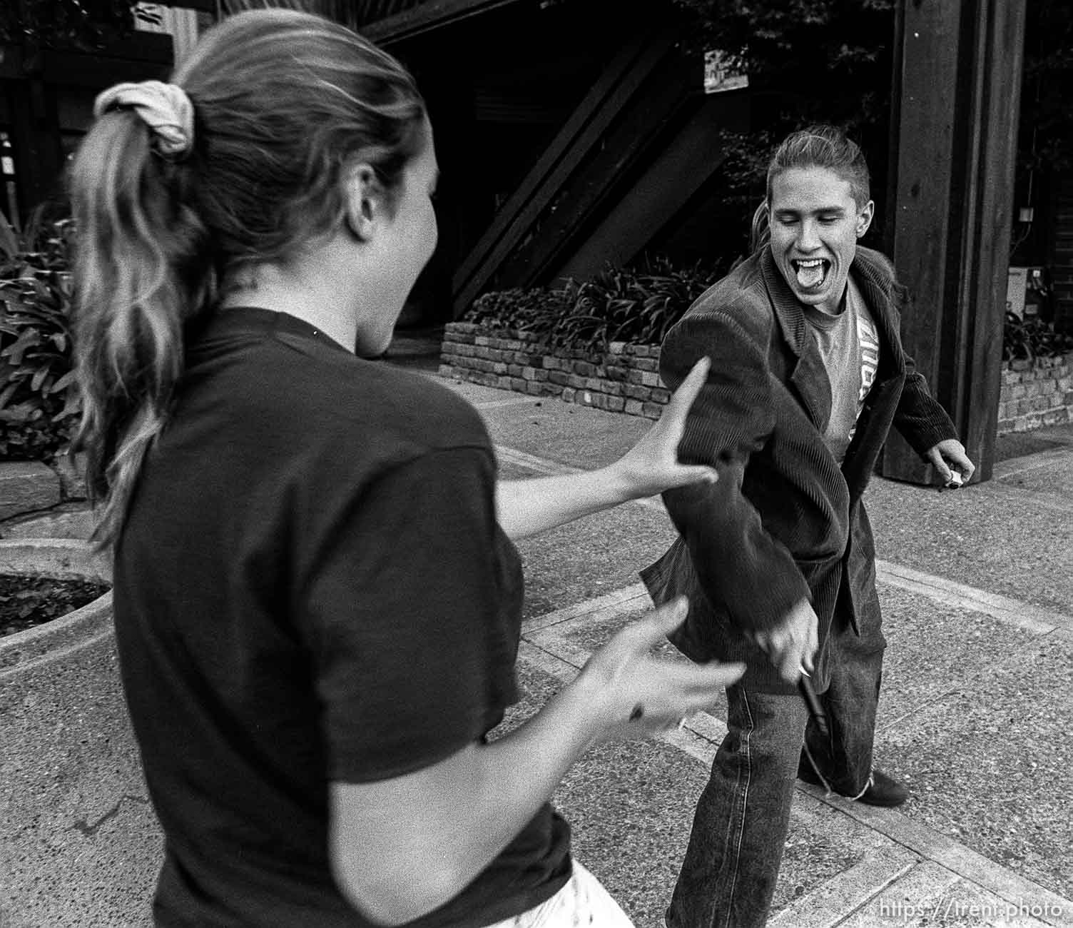 Kids having a pen fight kids hanging out at Rheem