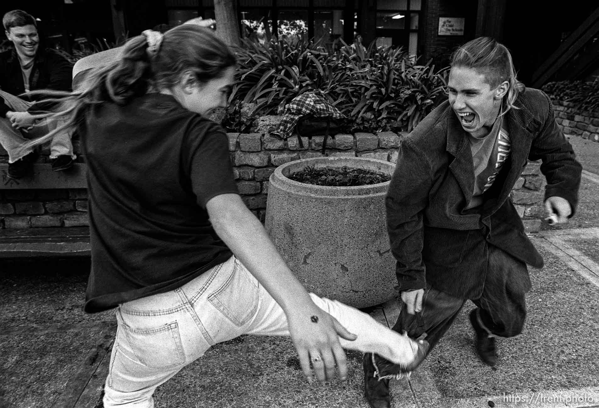 Kids having a pen fight kids hanging out at Rheem