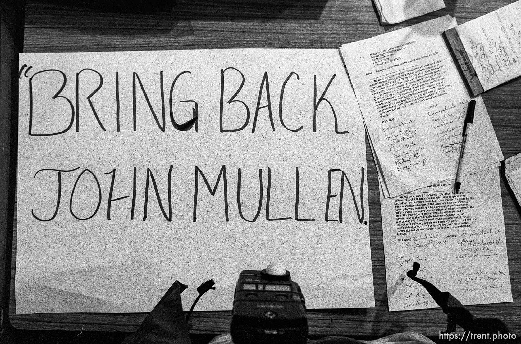 Signs and petition supporting John Mullen