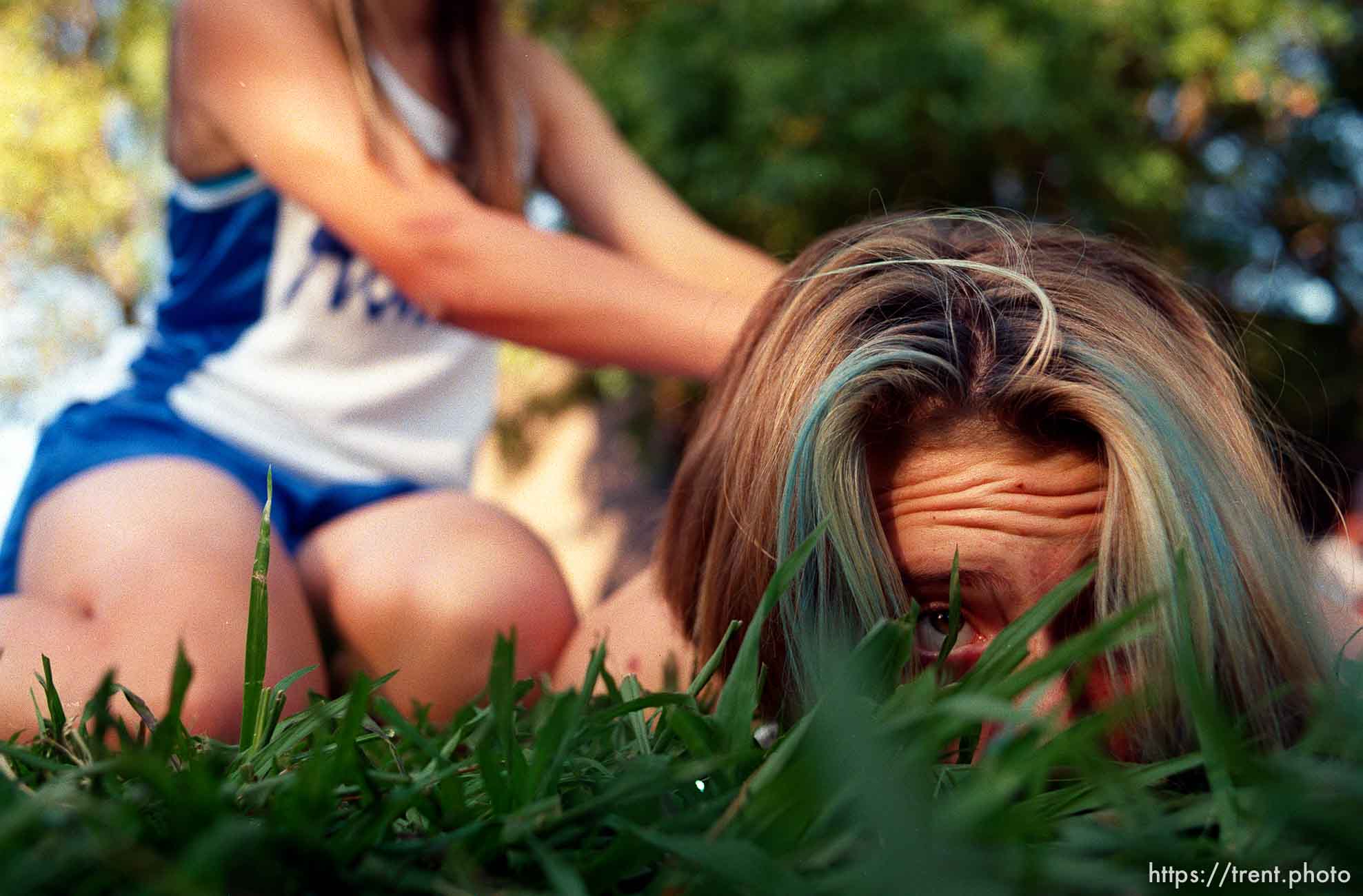 Acalanes runner Michelle Martin gets a backrub at Acalanes vs. Miramonte cross-country