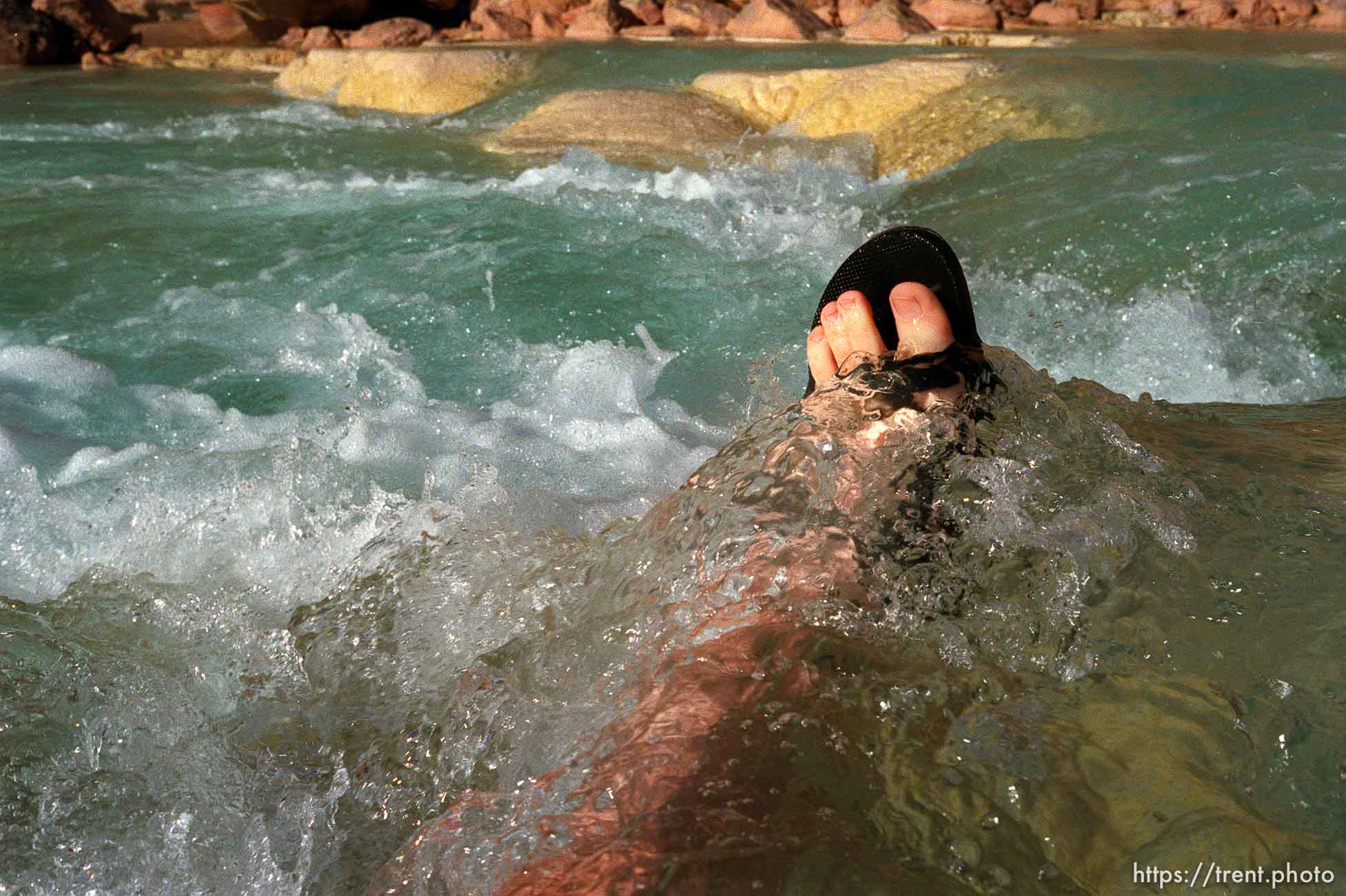 Trent feet in the blue water of the Little Colorado. Grand Canyon flood trip.