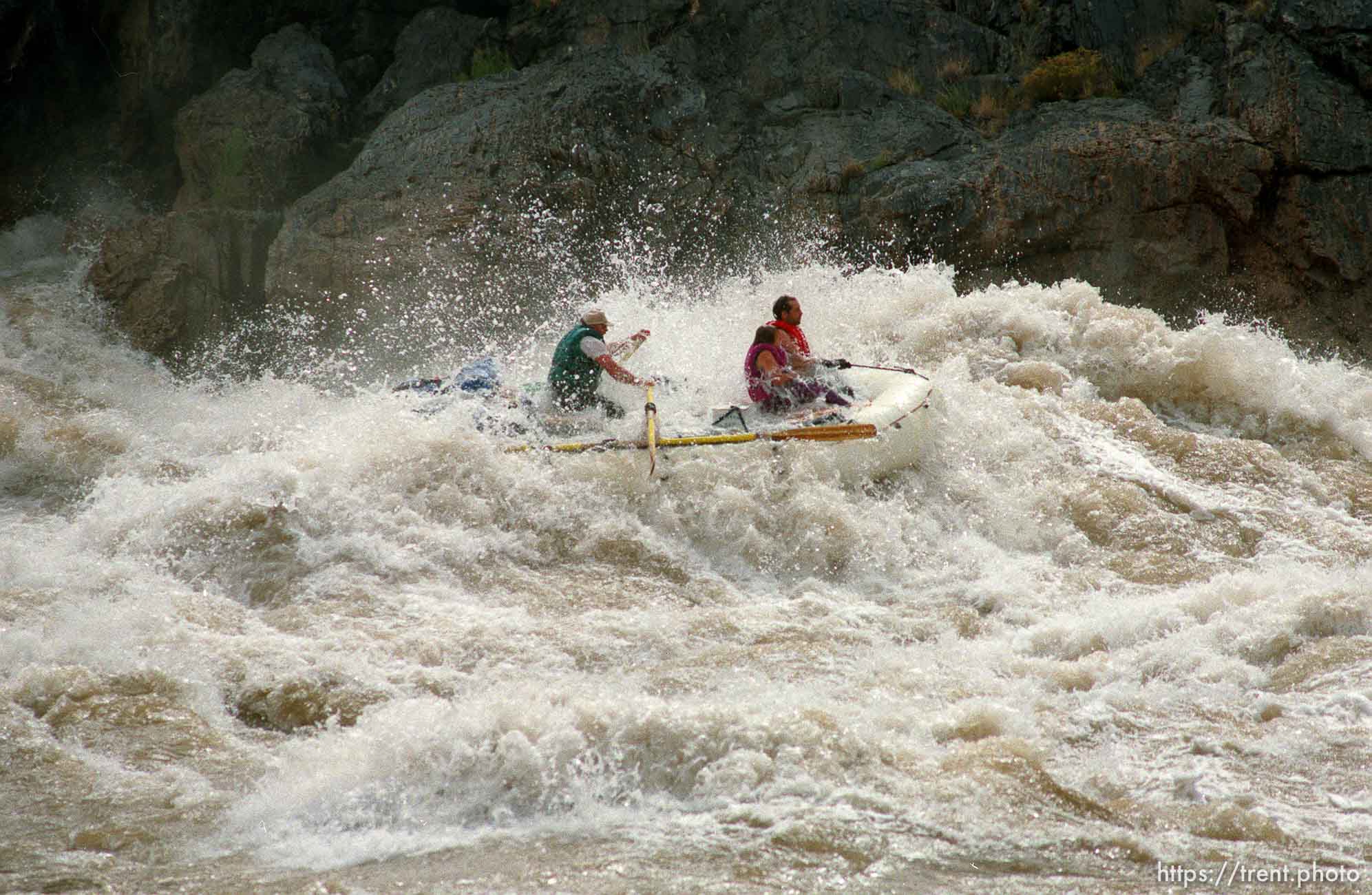 Inflatable raft in Crystal Rapid. Grand Canyon flood trip.