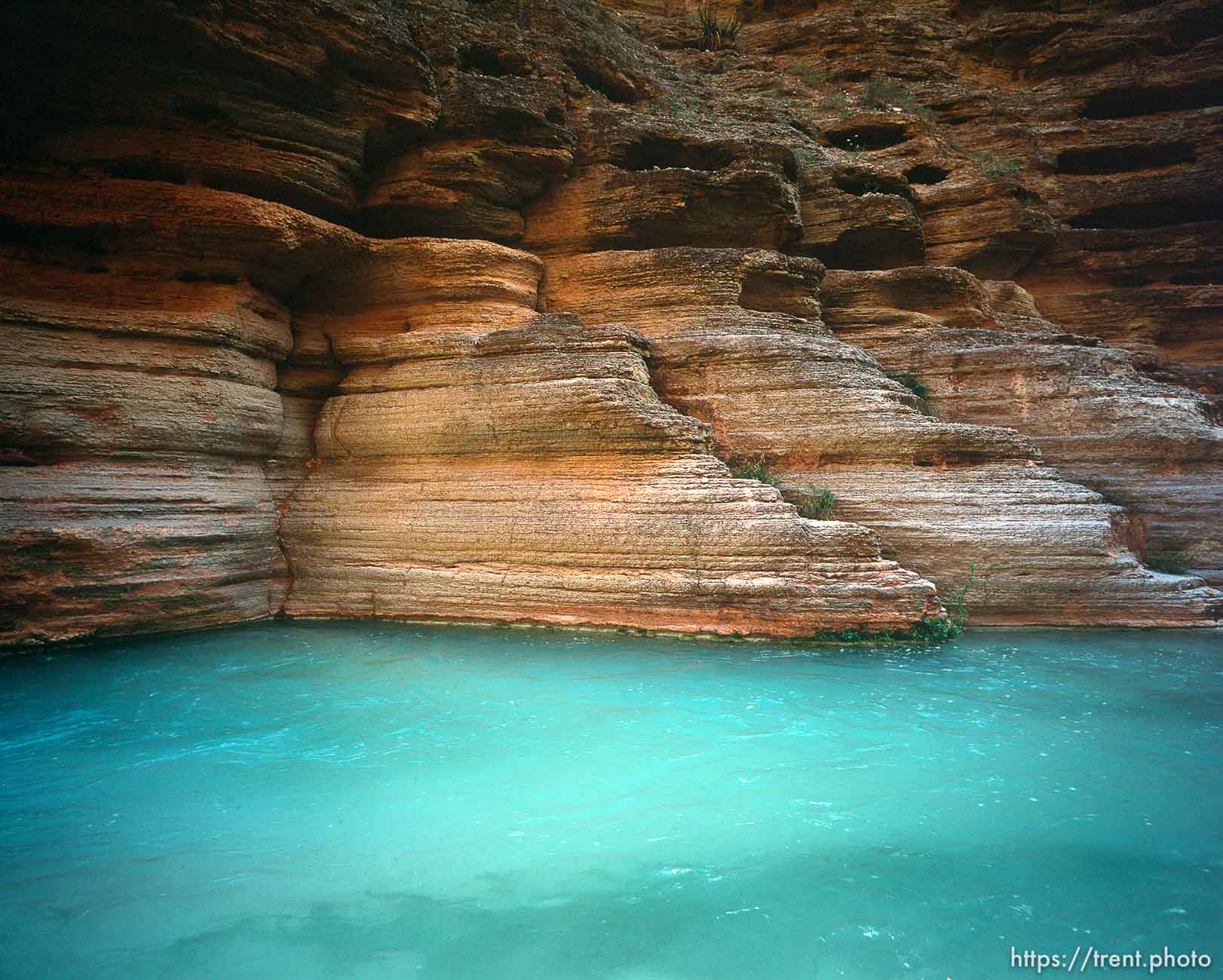 Blue water and rocks in Havisu Canyon. Grand Canyon flood trip.