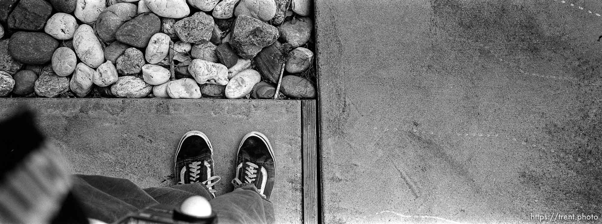 feet and rocks and driveway at home