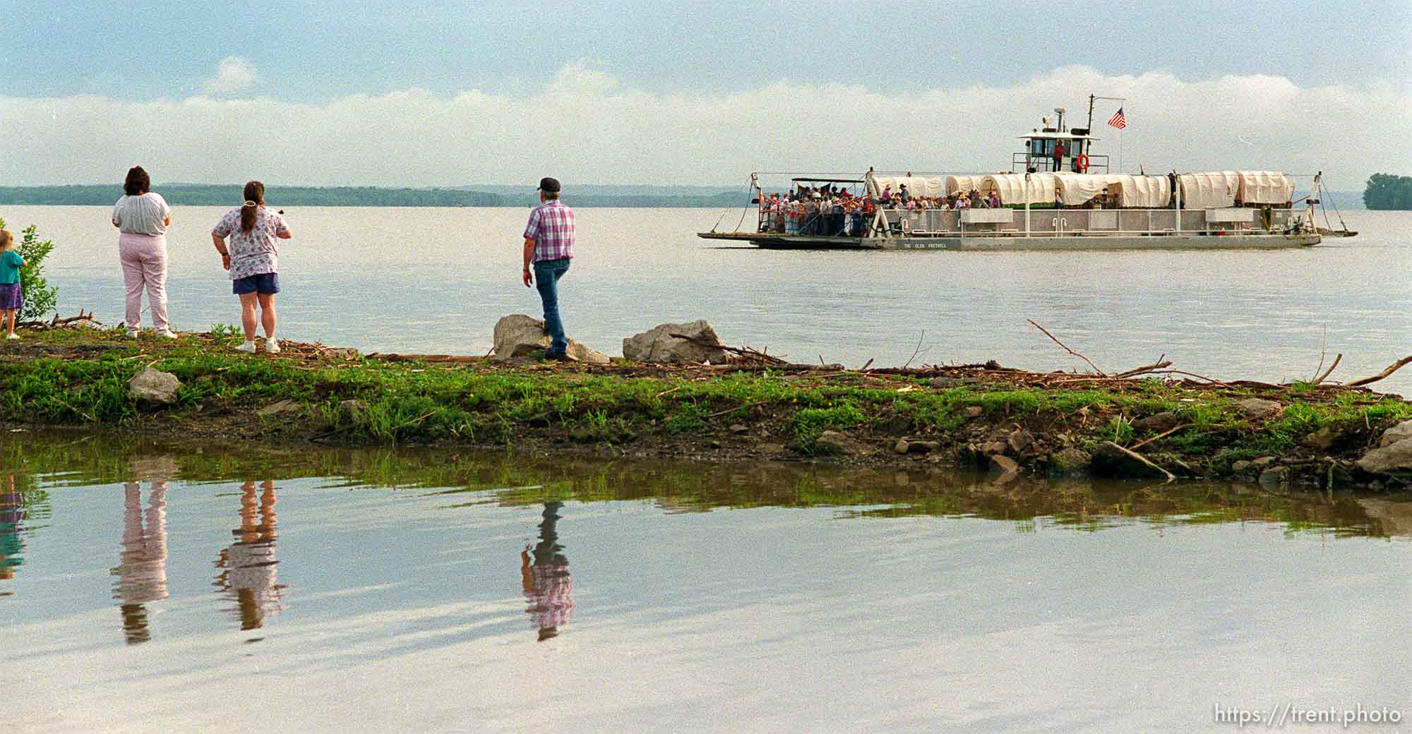 Ferry carries wagons across Mississippi River at Mormon Wagon Trail re-enactment