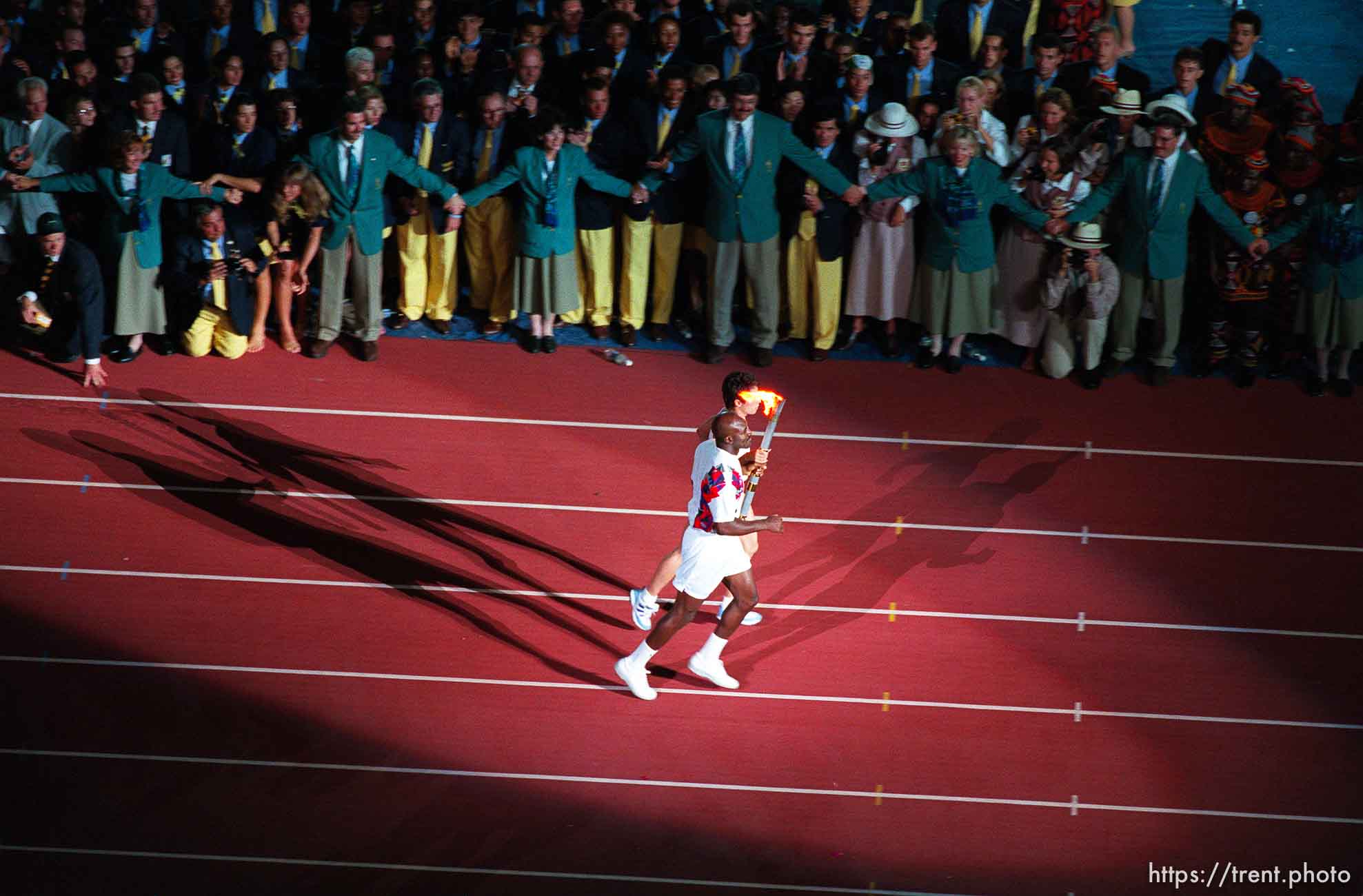 Evander Holyfield and ? with Olympic torch at the Opening Ceremony at the 1996 Summer Olympic Games