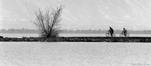 Sam Lunt and his niece Marilyn Knudsen ride their new mountain bikes along the south causeway at Utah Lake, provo.