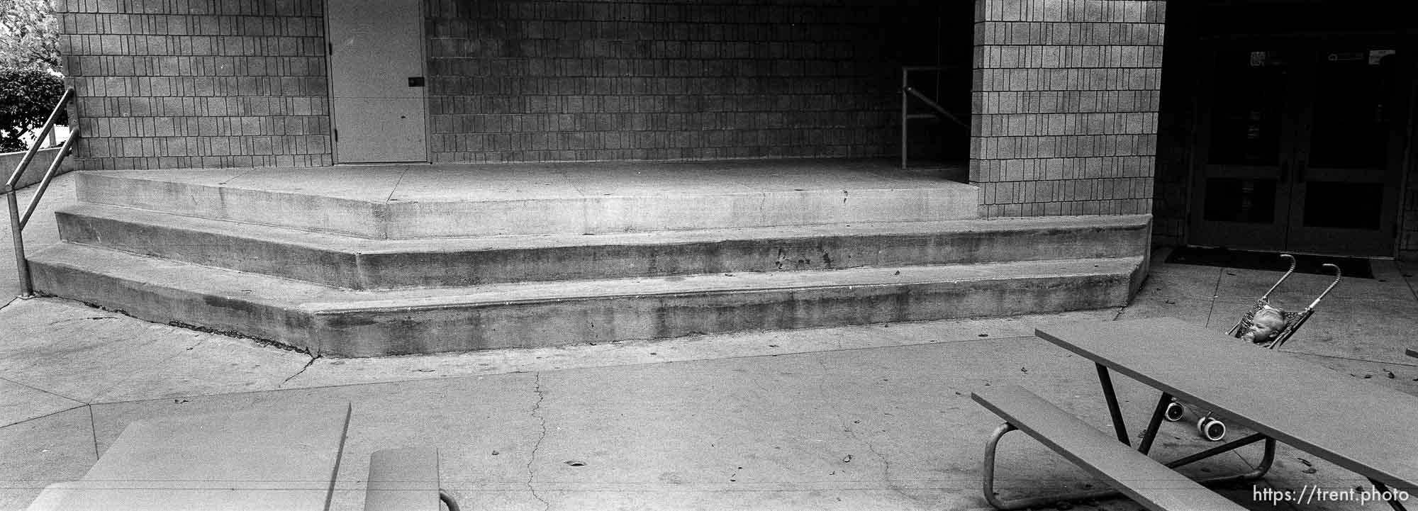 N in stroller in lunch area at Walt Disney Elementary School.