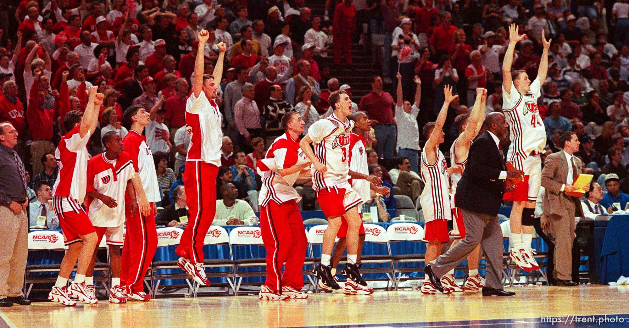 Team celebrates win at Utah vs Stanford, NCAA Tournament.