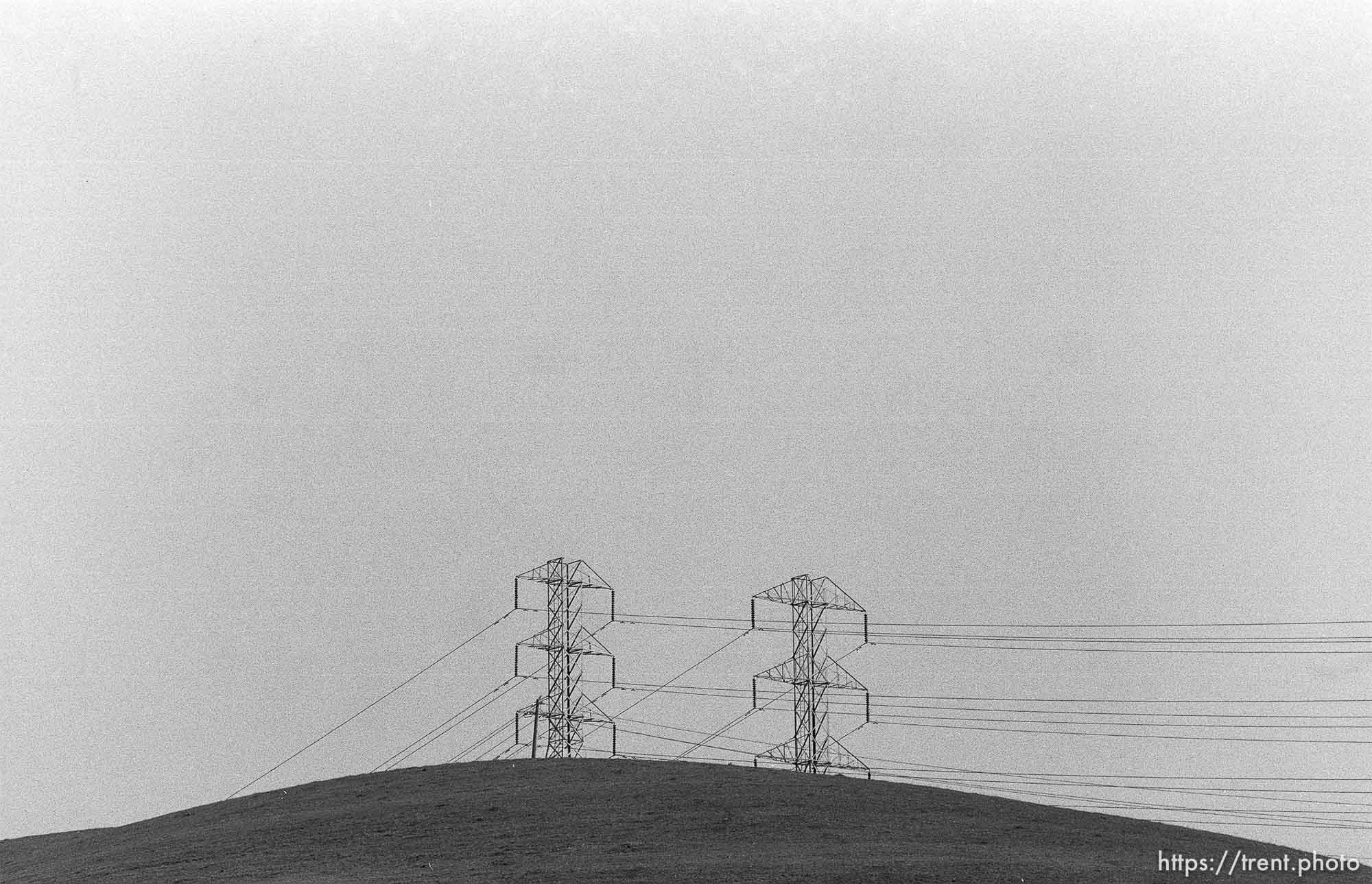 Powerlines and hill and sky