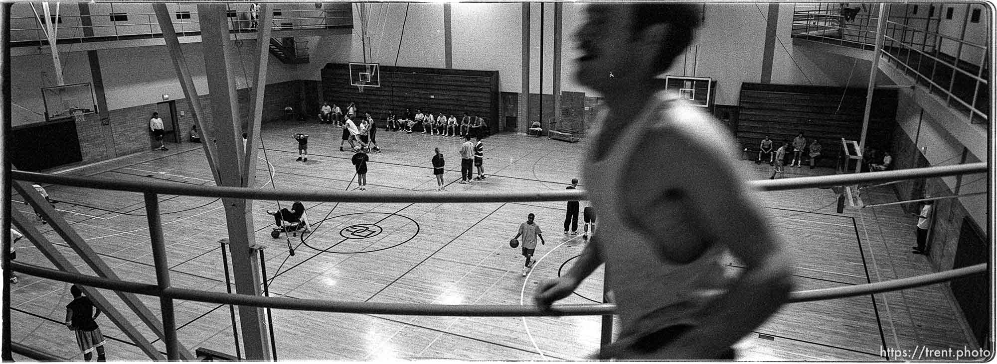 Kurston Krantz, a 7-year member of the Deseret Gym, jogs along a raised track overlooking the Hoop Fest 3-on-3 Basketball Tournament at the Deseret Gym.