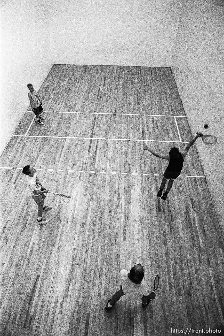 Clockwise from top left, Matt, Loren, Larry (father) and Dale Eggett, playing racquetball at the Deseret Gym. All eight members of the Eggett family came to the Gym and spent a day swimming, playing ball, etc. Larry has been a member for four years and often works out on lunch breaks (he works downtown). Larry's father was a member before the current building was even built.