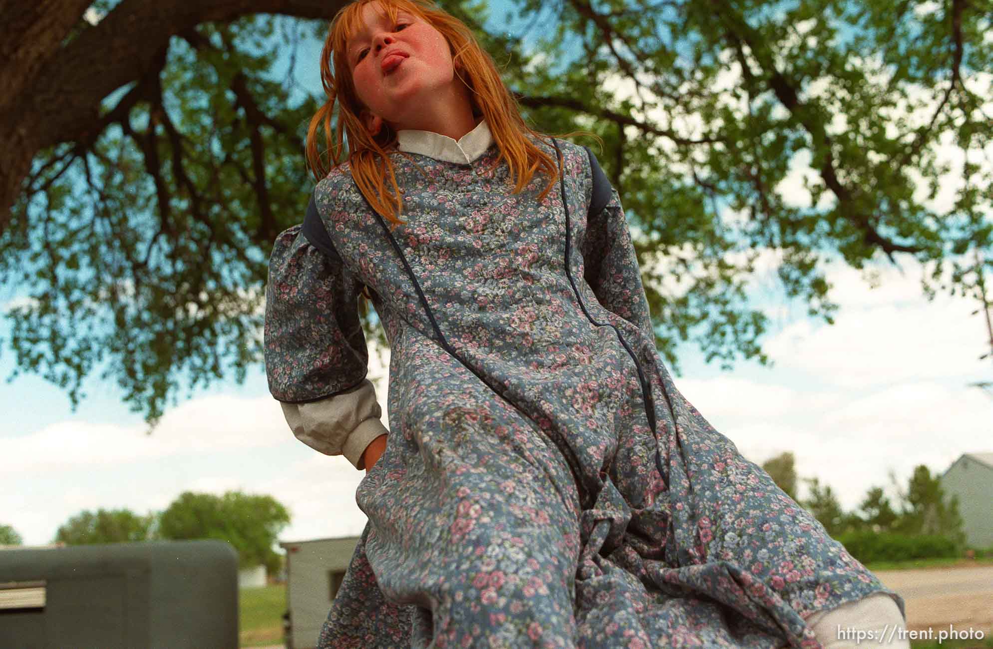 Kimberly Starling, 10, on a teeter-totter at a school playground.