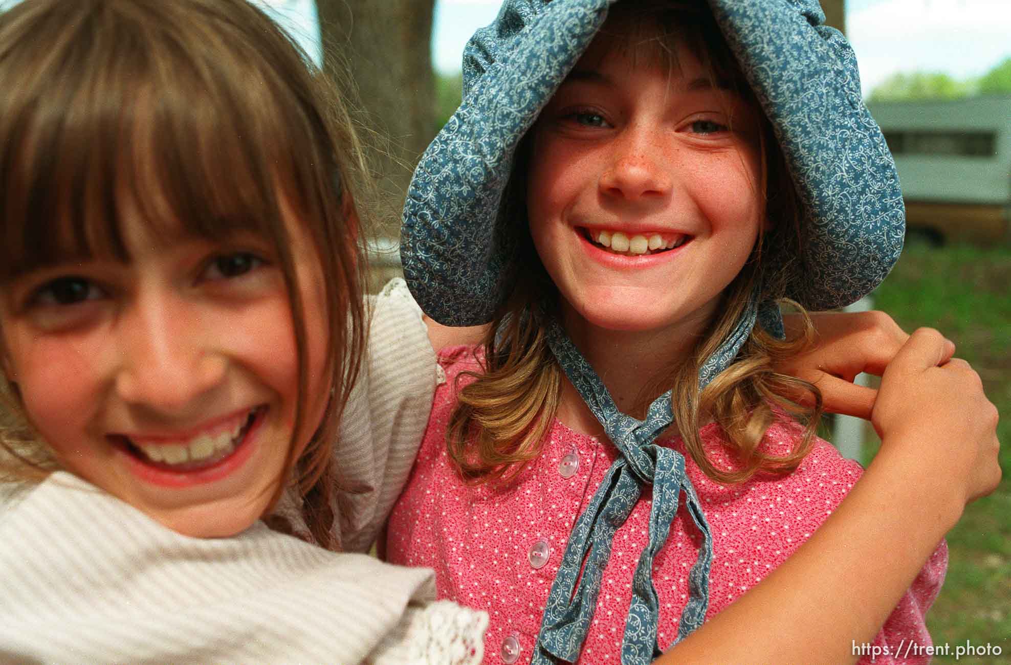 Two girls at a school playground.