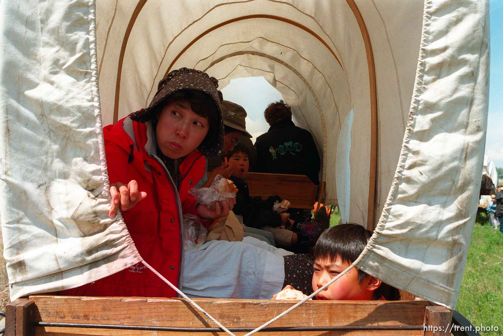 Japanese family on train. Left to right: Takako Sekiguchi, Osamu, Koji, Yuji as the Mormon Trail Wagon Train stops for lunch.