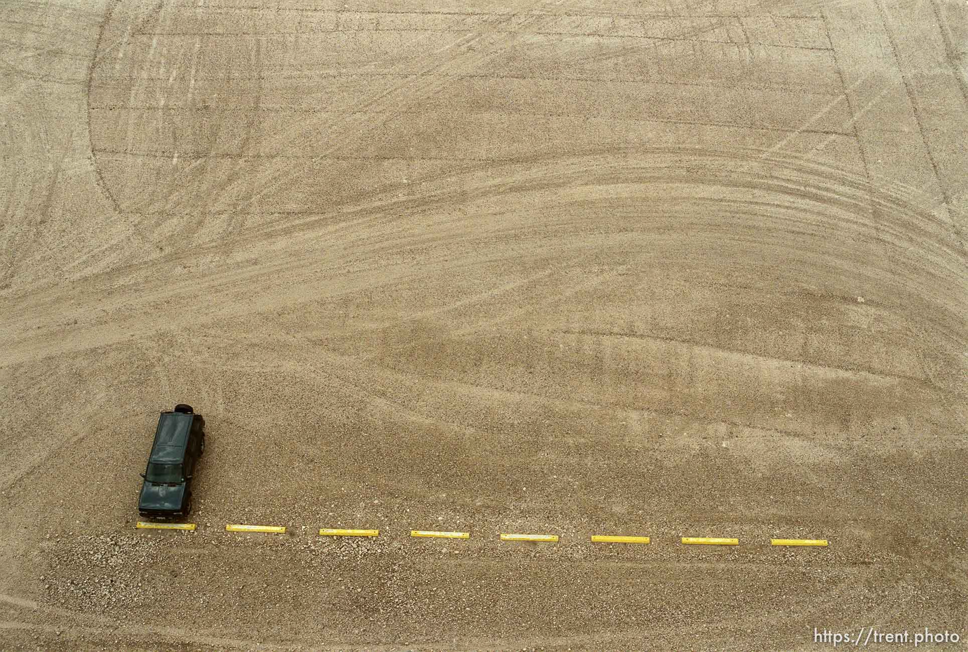 Car in empty lot from the top of a grain elevator at Jack's Bean Company.