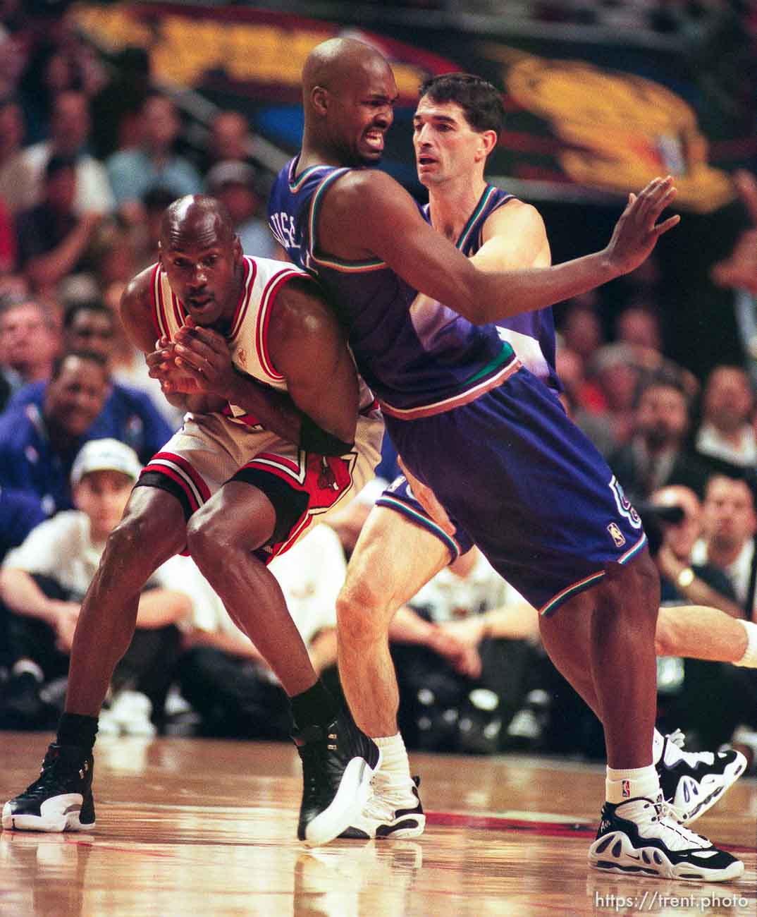 Chicago's Michael Jordan, Utah's Bryon Russell, John Stockton at game 6, NBA Finals, Utah Jazz vs Chicago Bulls. Bulls won this game to win their fifth NBA Championship in the Michael Jordan era.