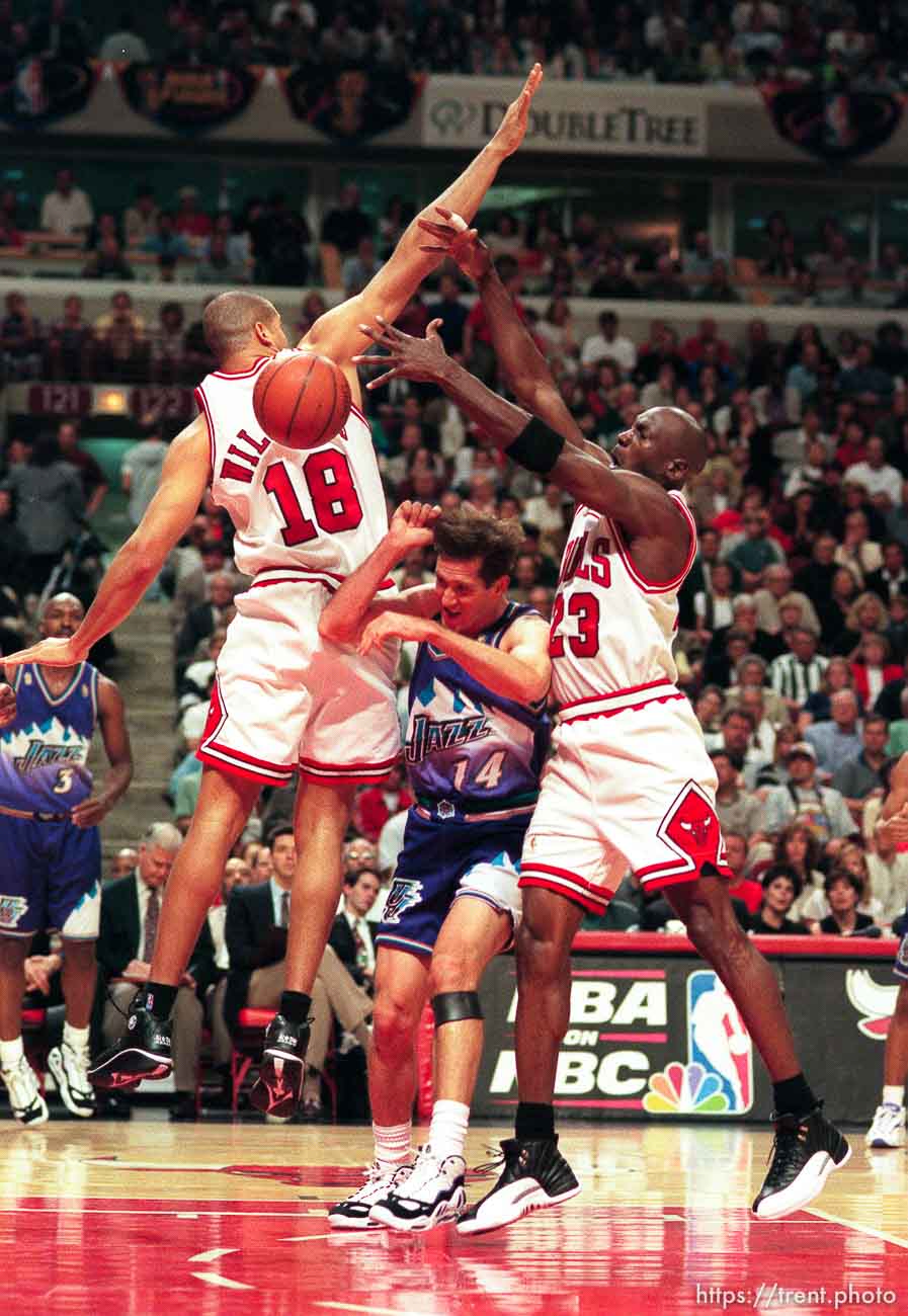 Utah's Jef Hornacek (center) goes between Chicago's Brian Williams and Michael Jordan at game 6, NBA Finals, Utah Jazz vs Chicago Bulls. Bulls won this game to win their fifth NBA Championship in the Michael Jordan era.