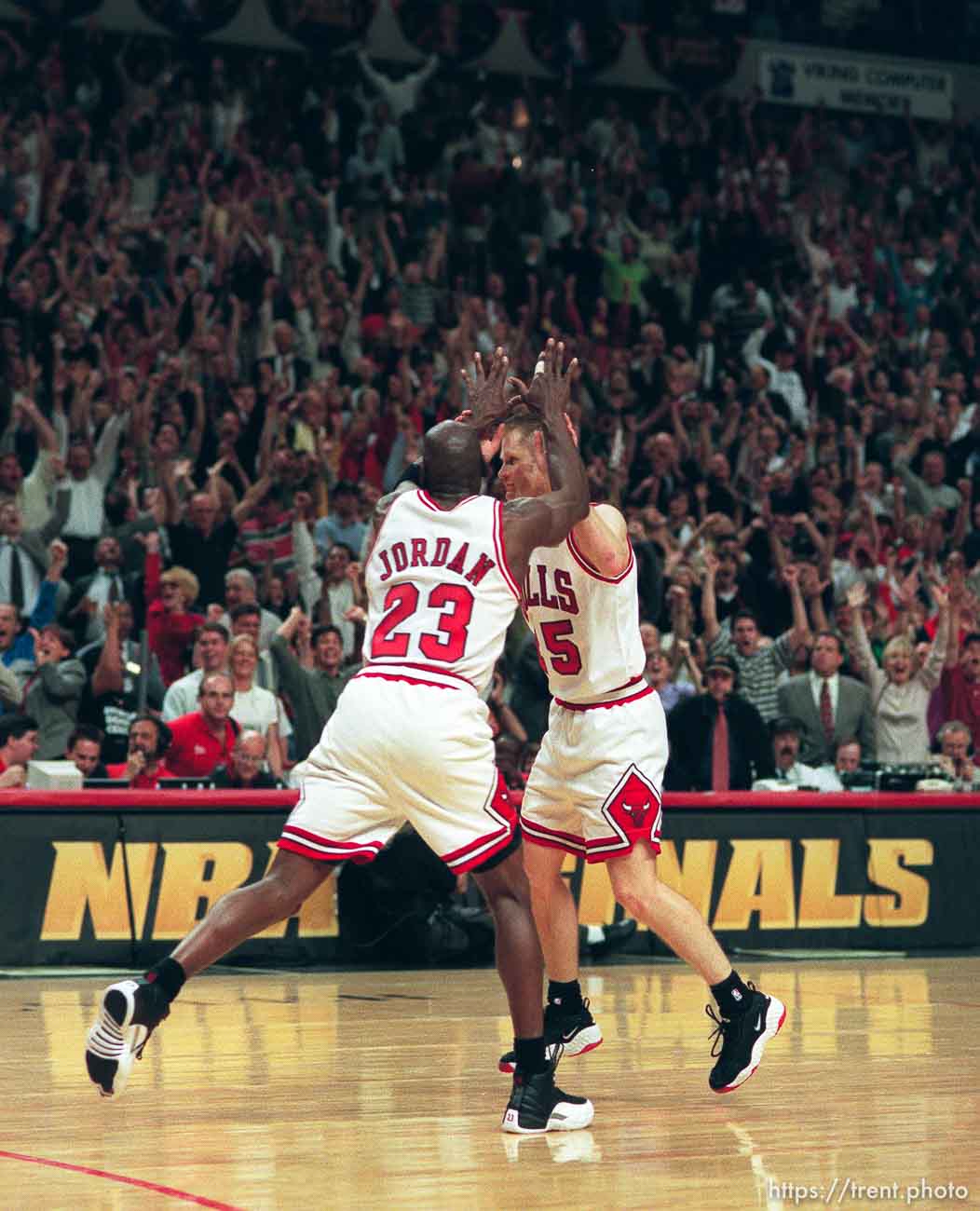 Chicago's Michael Jordan high-fives Steve Kerr after he hit a crucial three-pointer during game 6, NBA Finals, Utah Jazz vs Chicago Bulls. Bulls won this game to win their fifth NBA Championship in the Michael Jordan era.