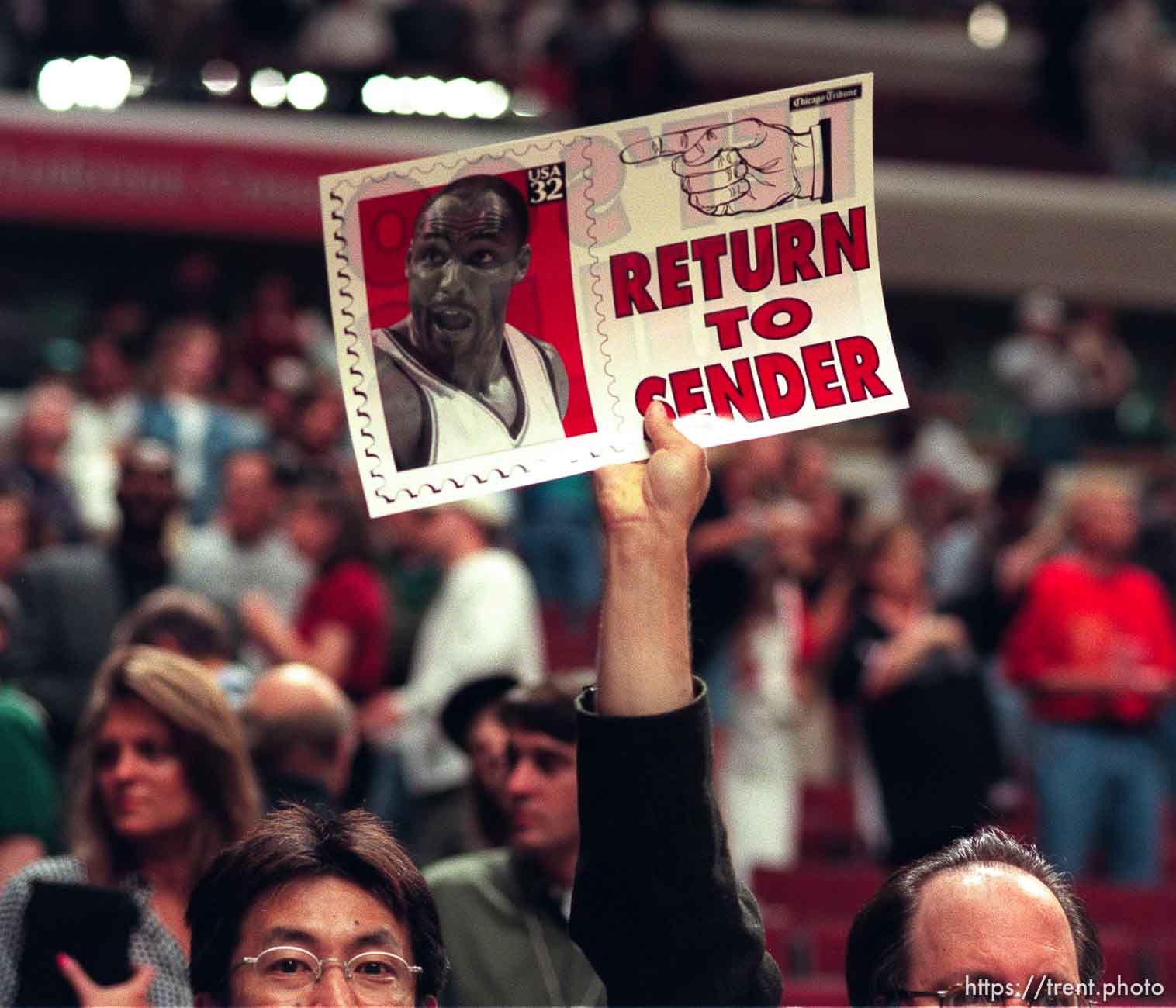 Chicago fans hold up an anti-Karl Malone poster at game 6, NBA Finals, Utah Jazz vs Chicago Bulls. Bulls won this game to win their fifth NBA Championship in the Michael Jordan era.