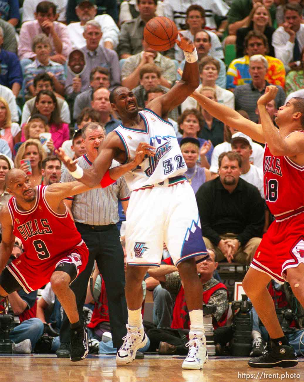 Utah's Karl Malone defended by Chicago's Ron Harper and Brian Williams at the NBA Finals Game three, Utah Jazz vs Chicago Bulls.