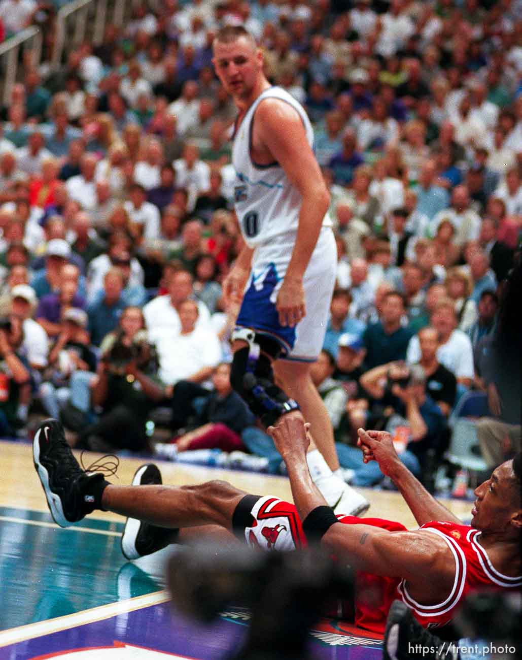 Chicago's Scottie Pippen knocked to the floor by Utah's Greg Ostertag just before they got into a near-fight at the NBA Finals Game four, Utah Jazz vs Chicago Bulls.