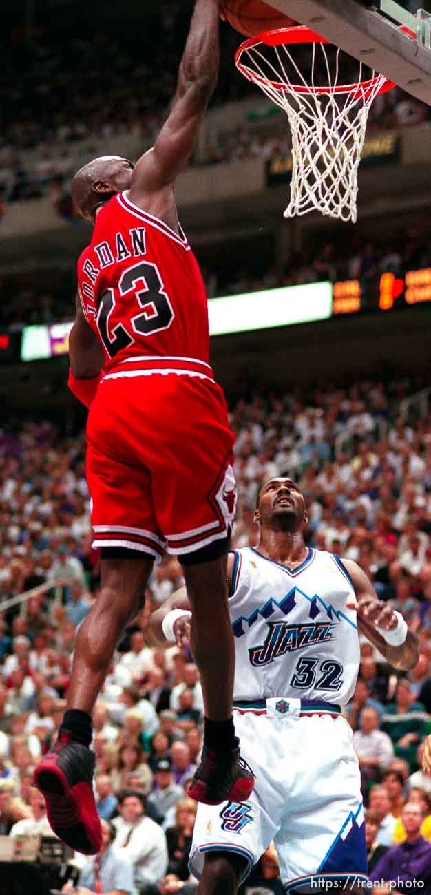 Chicago's Michael Jordan dunks over Utah's Karl Malone at the NBA Finals Game four, Utah Jazz vs Chicago Bulls.