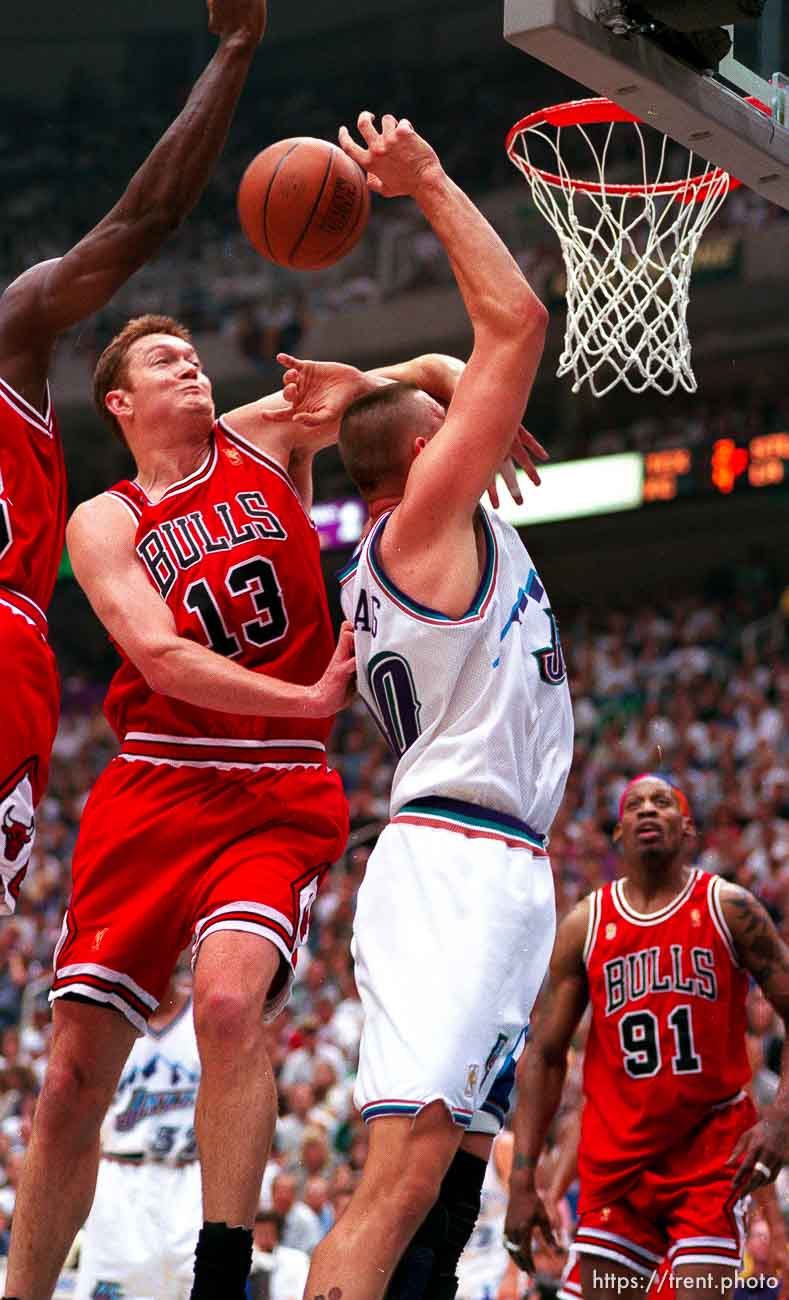 Chicago's Luc Longley hammers Utah's Greg Ostertag at the NBA Finals Game four, Utah Jazz vs Chicago Bulls.