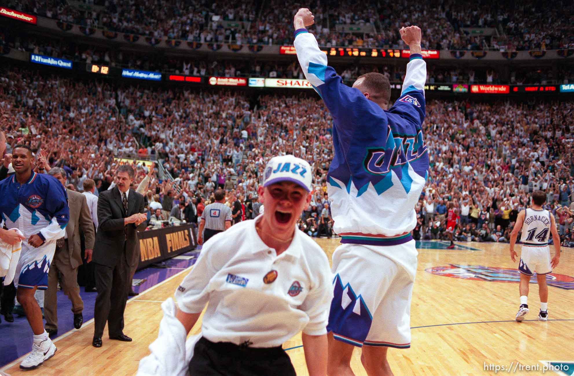 Ball boy and Utah's Greg Foster (arms up) celebrate victory at the NBA Finals Game four, Utah Jazz vs Chicago Bulls.