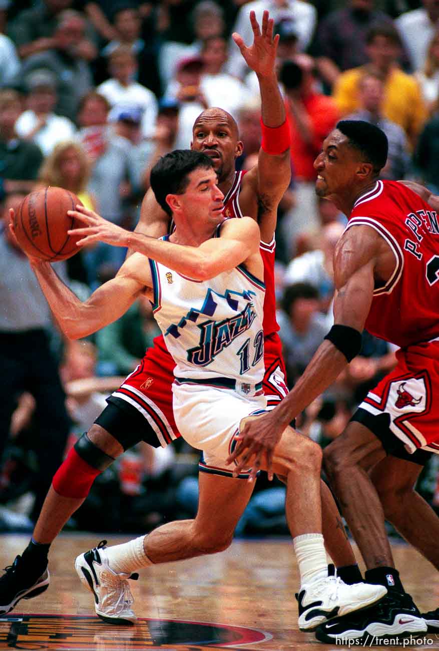 Utah's John Stockton is defended by Chicago's Ron Harper and Scottie Pippen at the NBA Finals Game four, Utah Jazz vs Chicago Bulls.