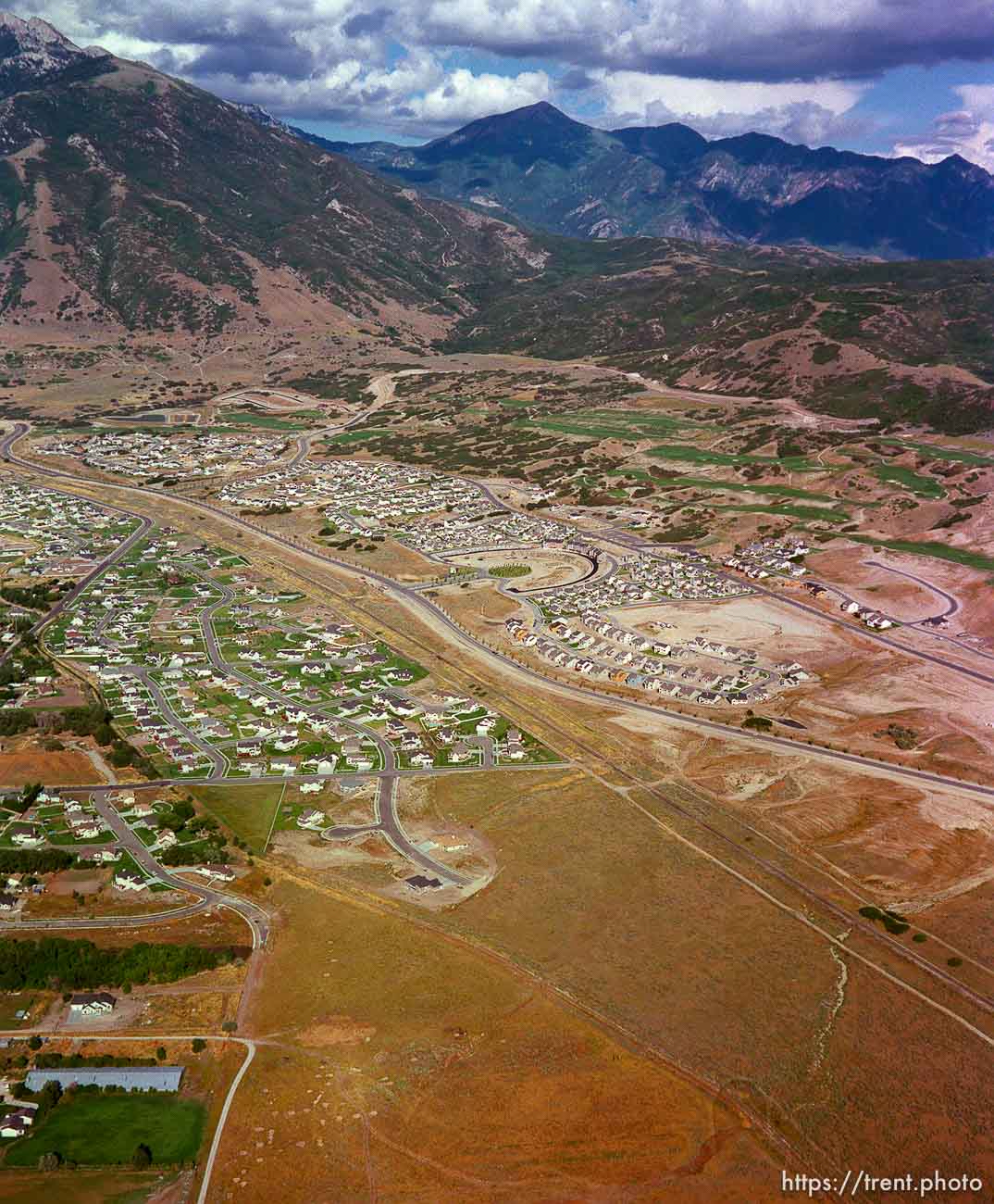 Homes being built shot from the air.