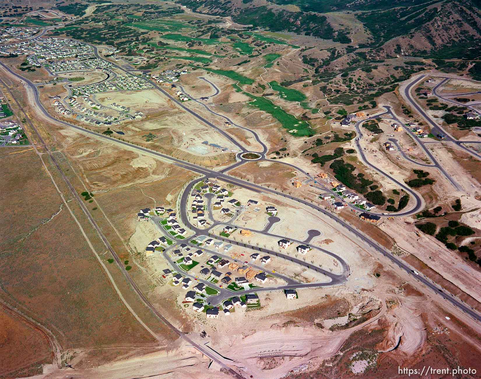 Homes being built shot from the air.